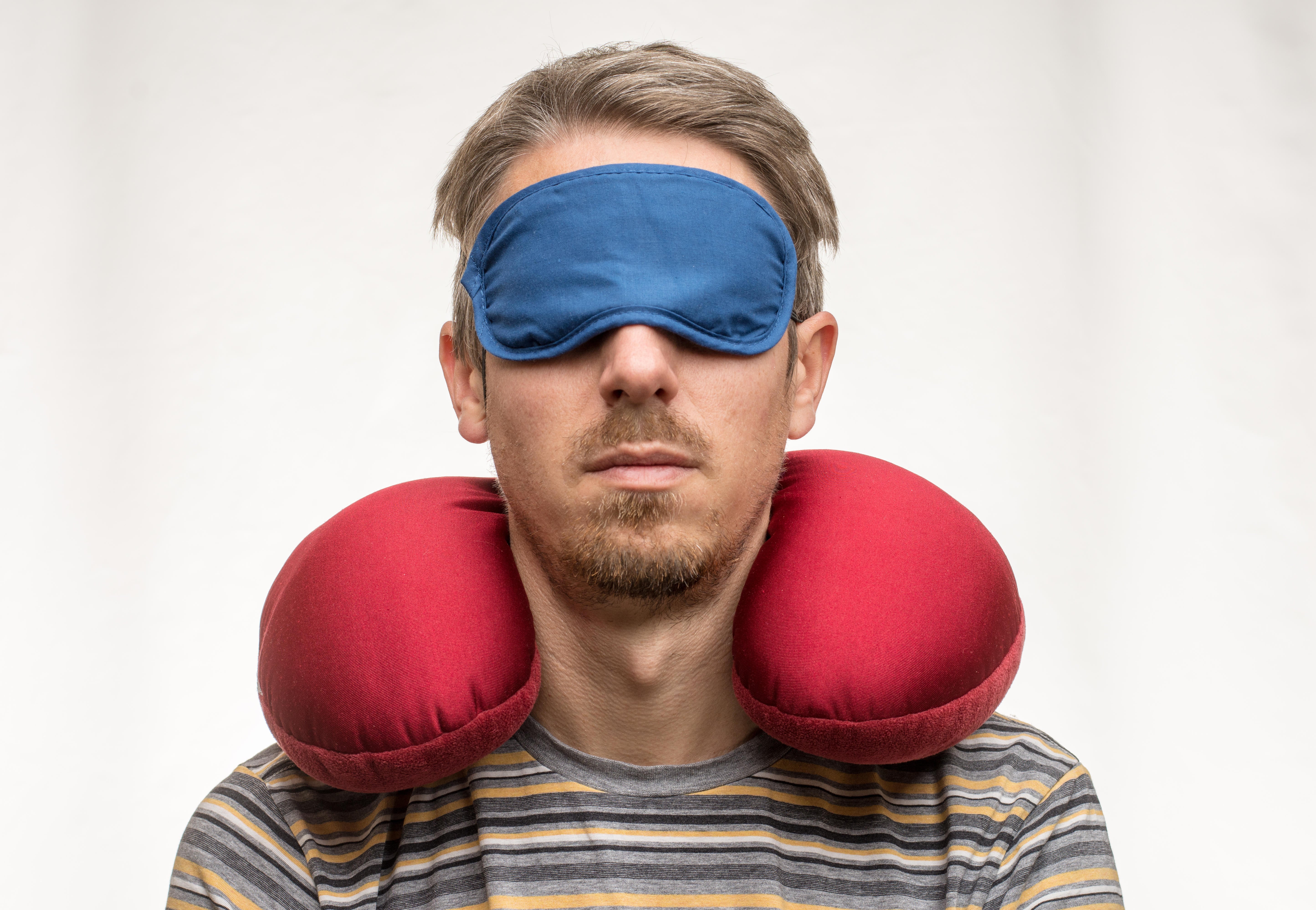 Eye masks and neck pillows could help keep you comfortable and asleep