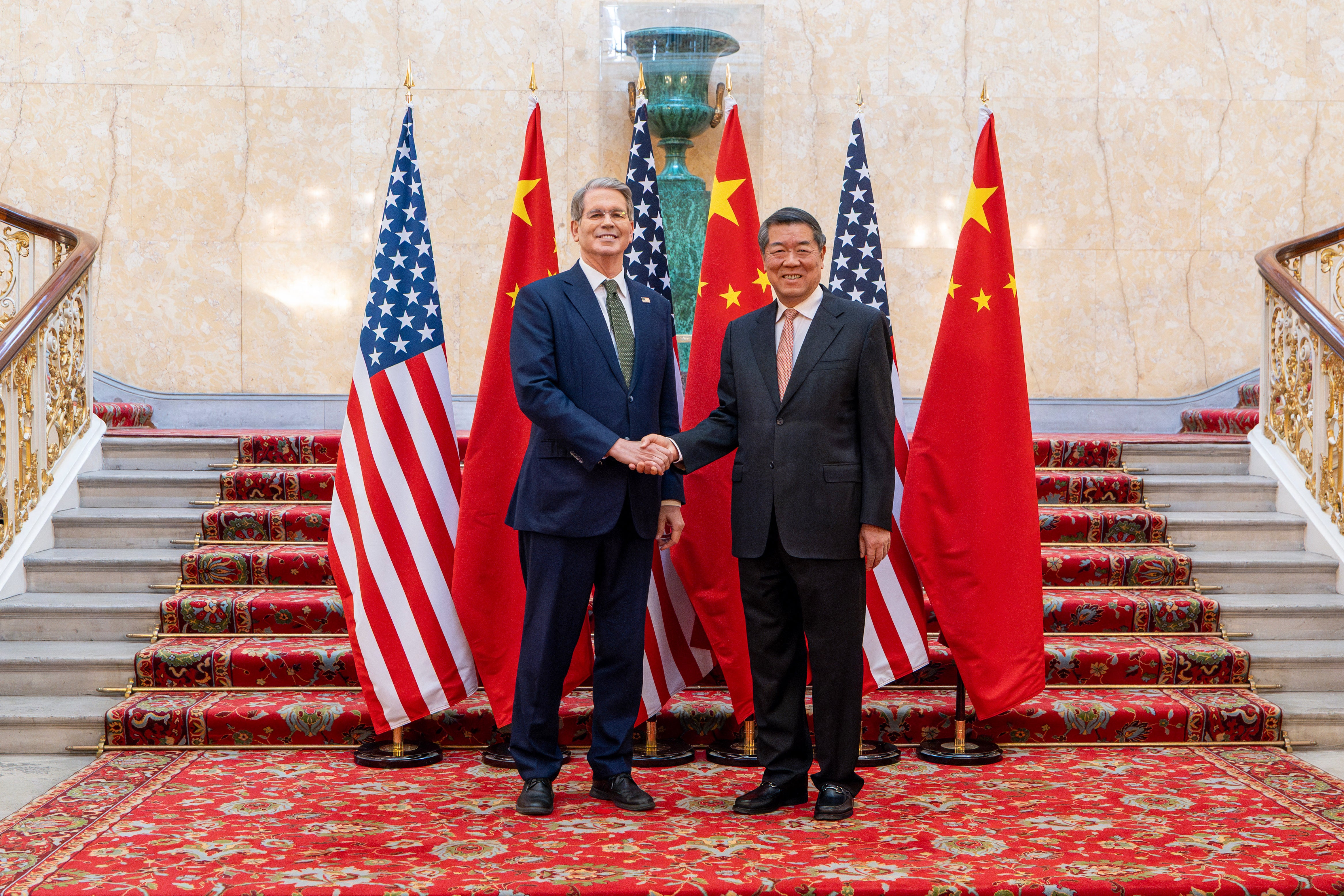 US treasury secretary Scott Bessent and Chinese vice premier He Lifeng pose for a photo during trade discussions at the Lancaster House in London on 9 June 2025