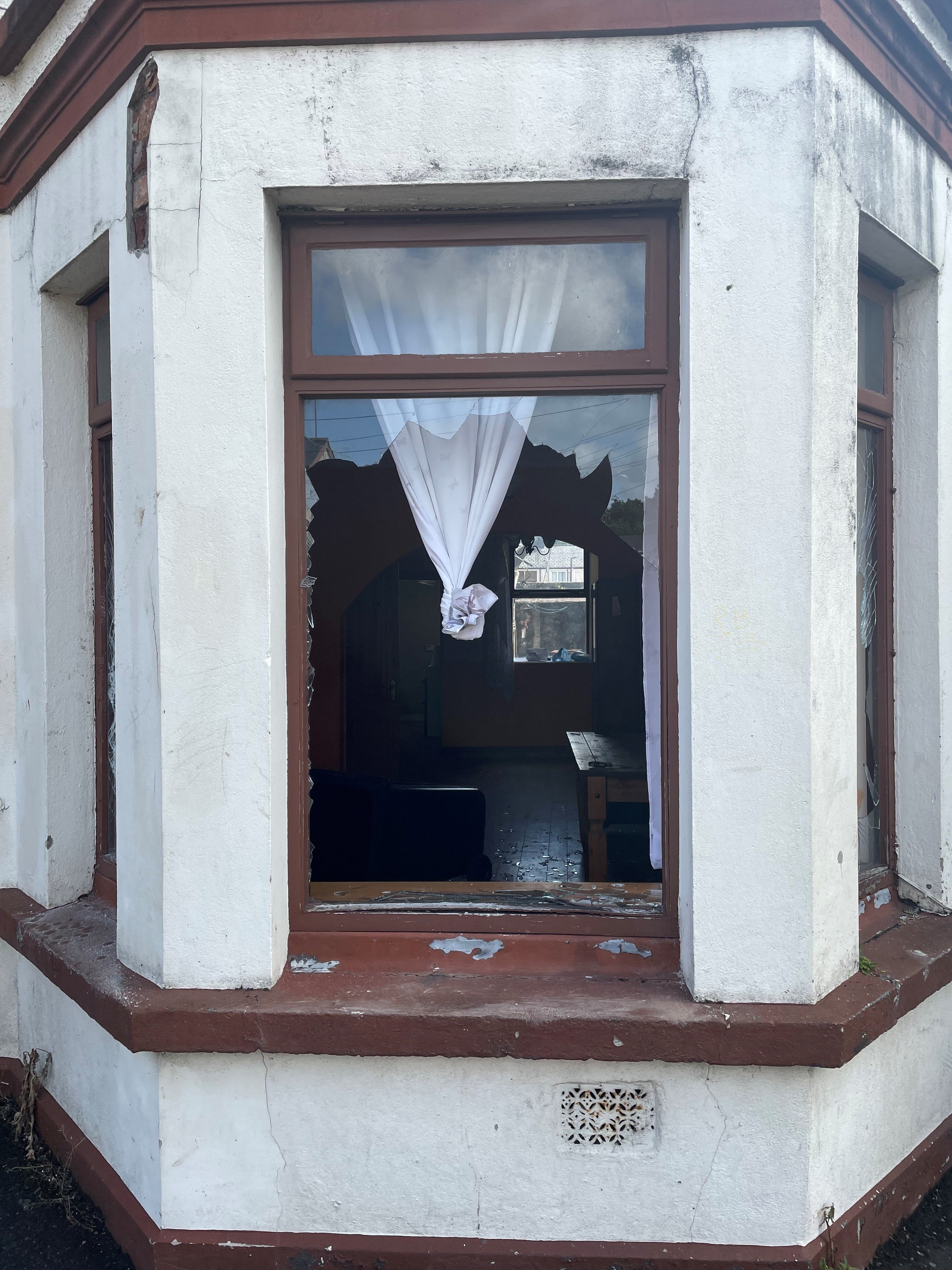 Windows were smashed by rioters as several houses were attacked