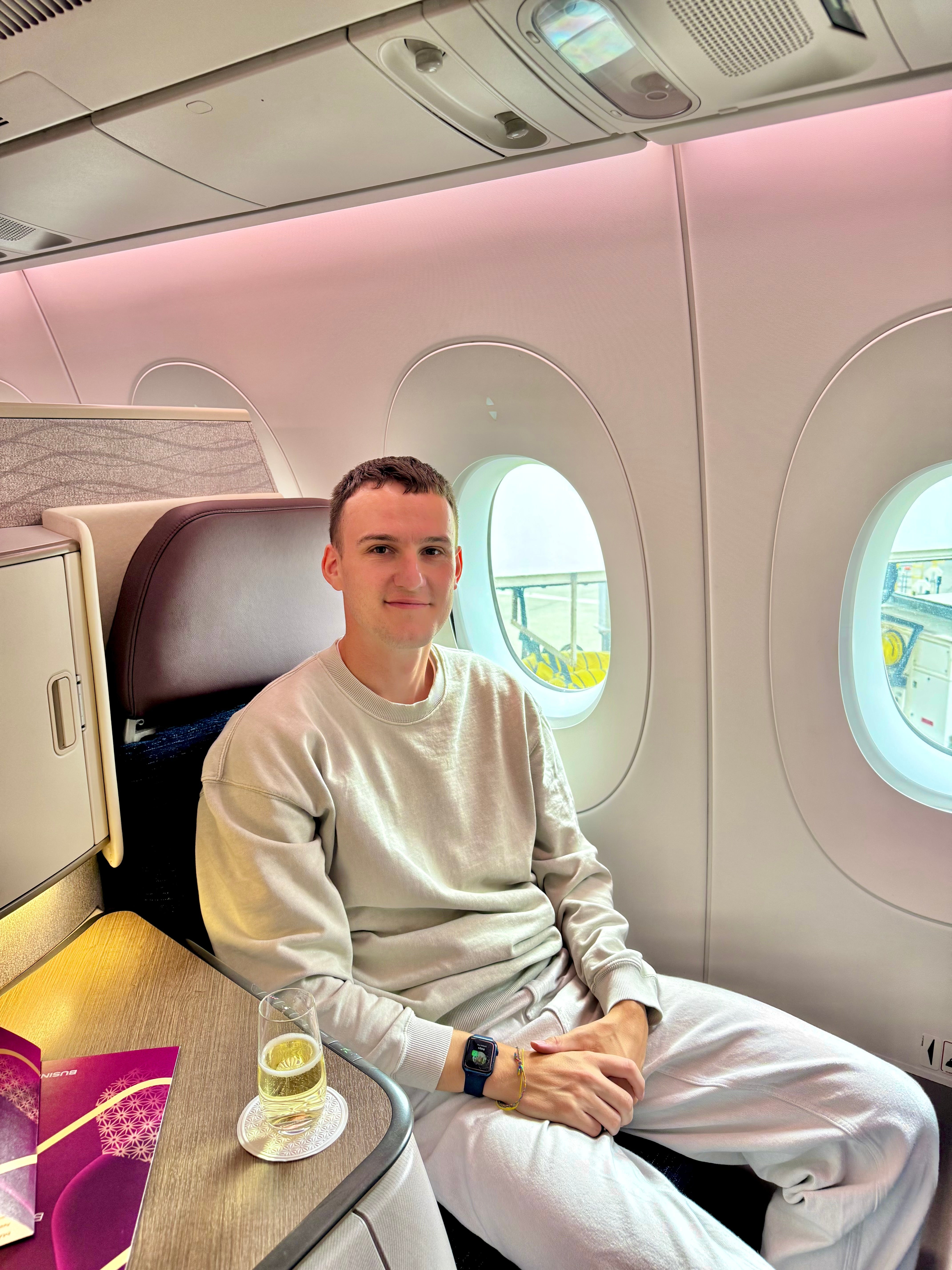 Rhys uses melatonin pills to claw back lost sleep. He's pictured here on an Air India Airbus A350 from London to Delhi