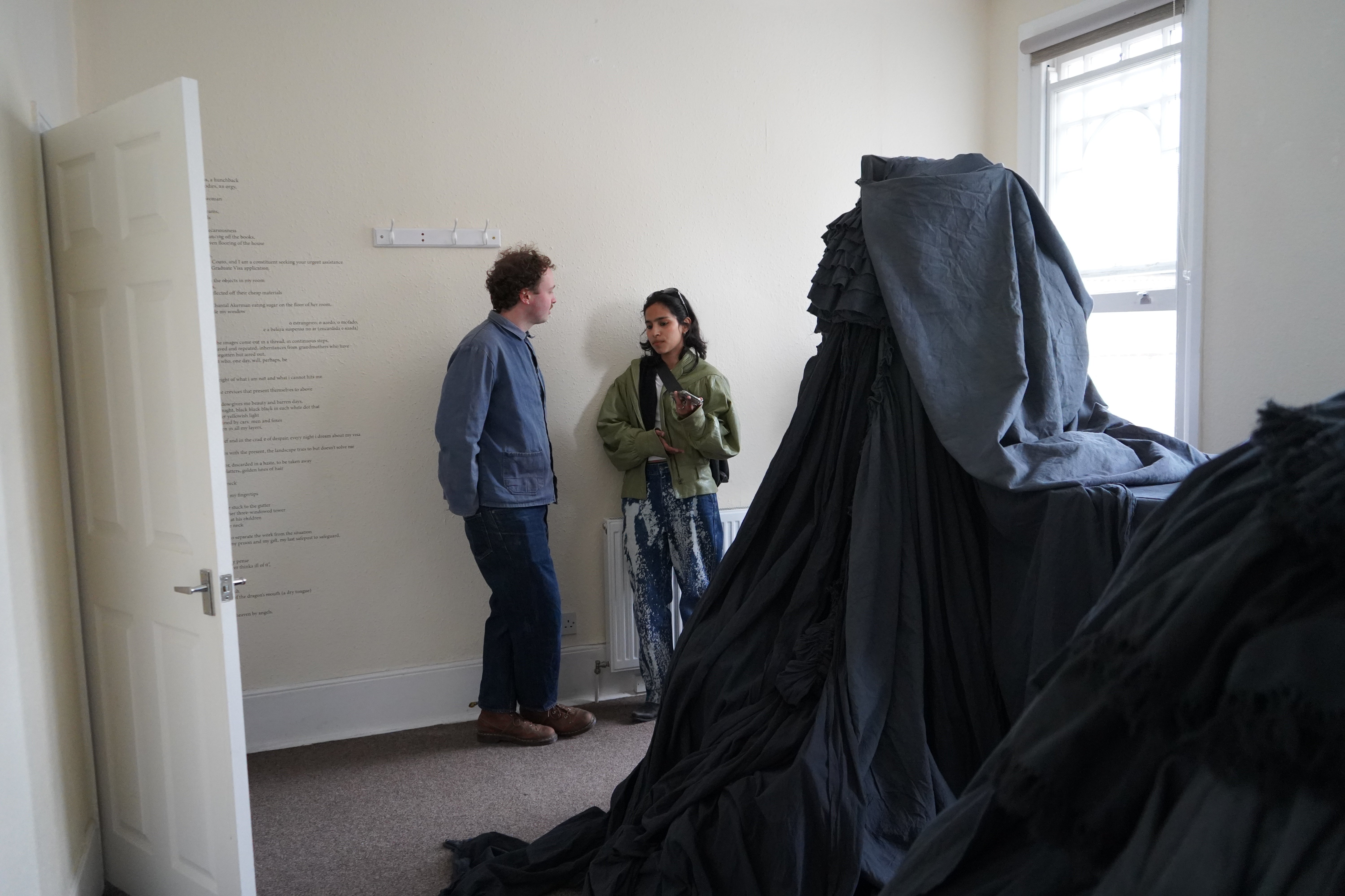 Visitors the temporary exhibition Couto held in her room about her experience