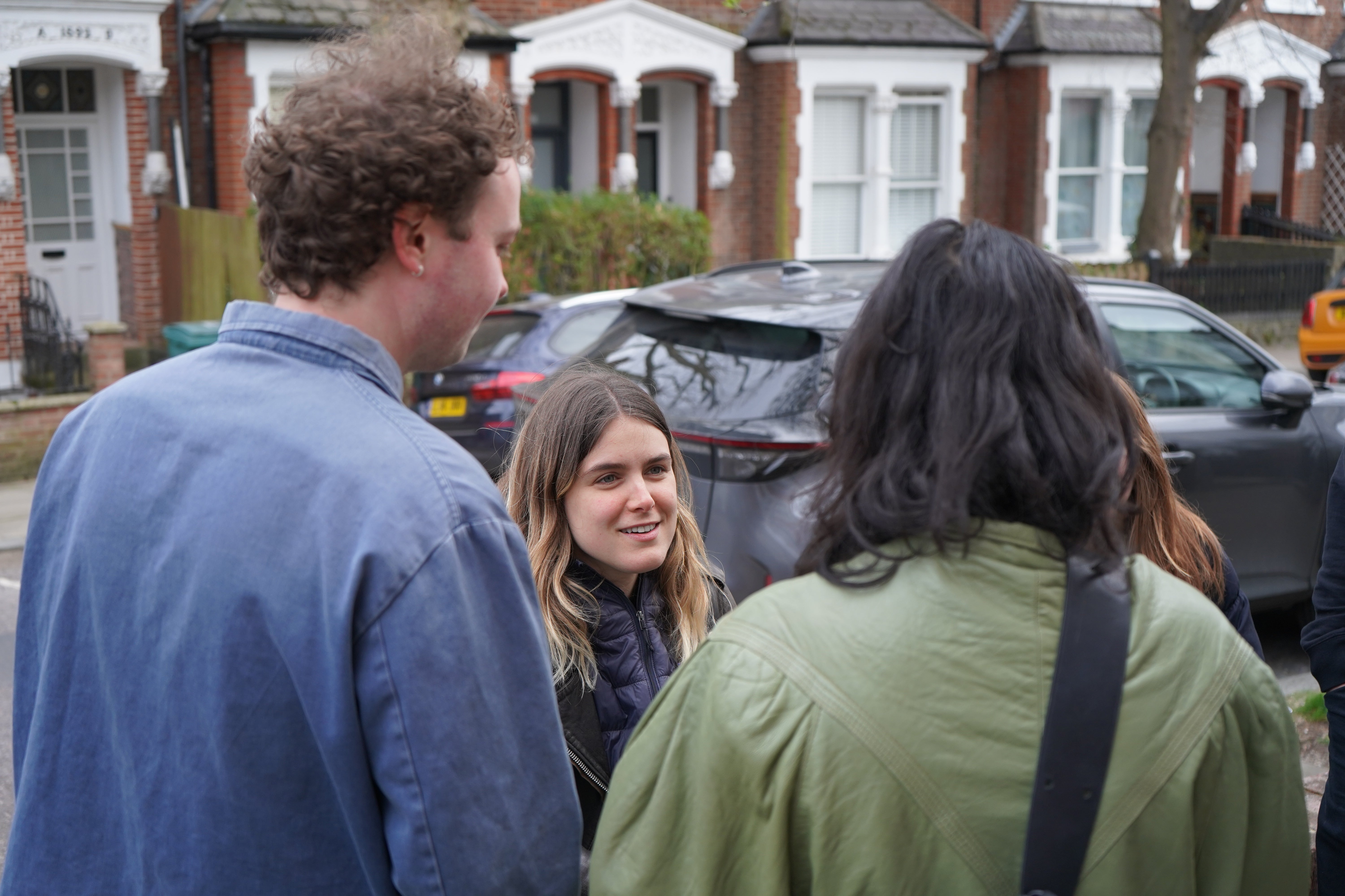 Couto welcomes visitors to an exhibition she held in her room while in visa limbo