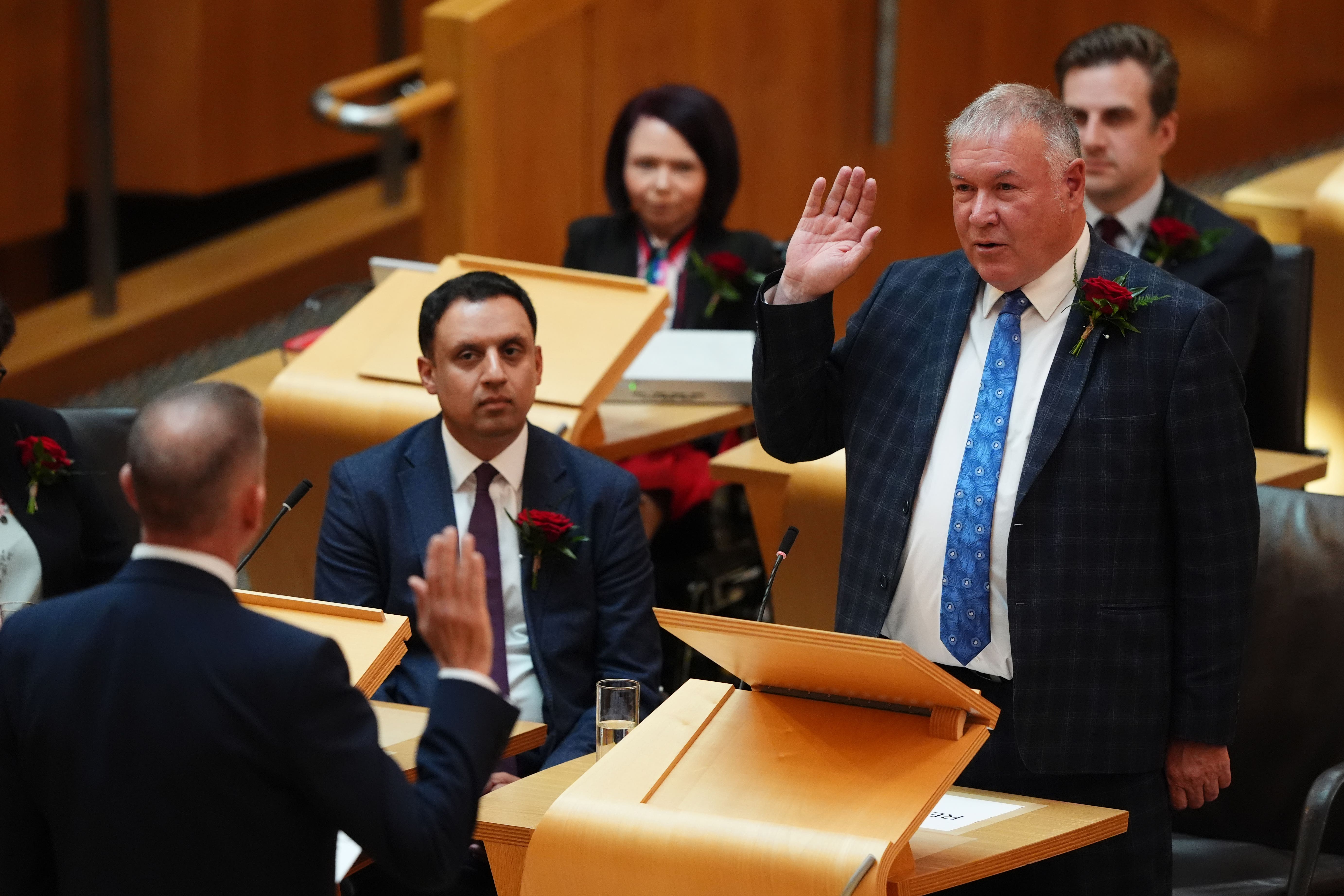 Newly elected MSP Davy Russell is sworn-in at the Scottish Parliament (Andrew Milligan/PA)