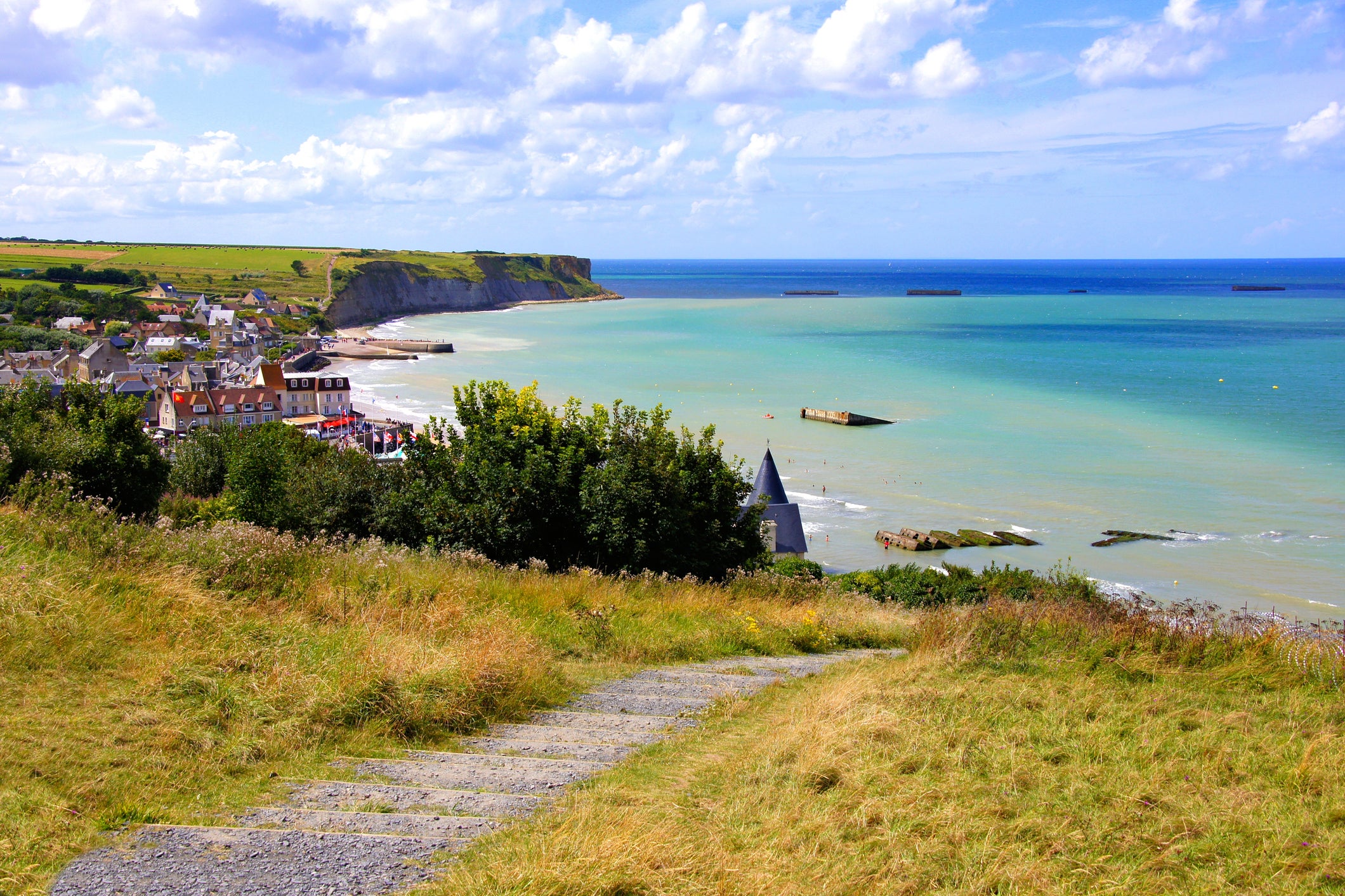 France is the most popular destination for Americans in terms of bookings, says Oliver's Travels. And searches for Normandy are up 600 percent. Pictured are the D-Day beaches at Arromanches les Bains in Normandy