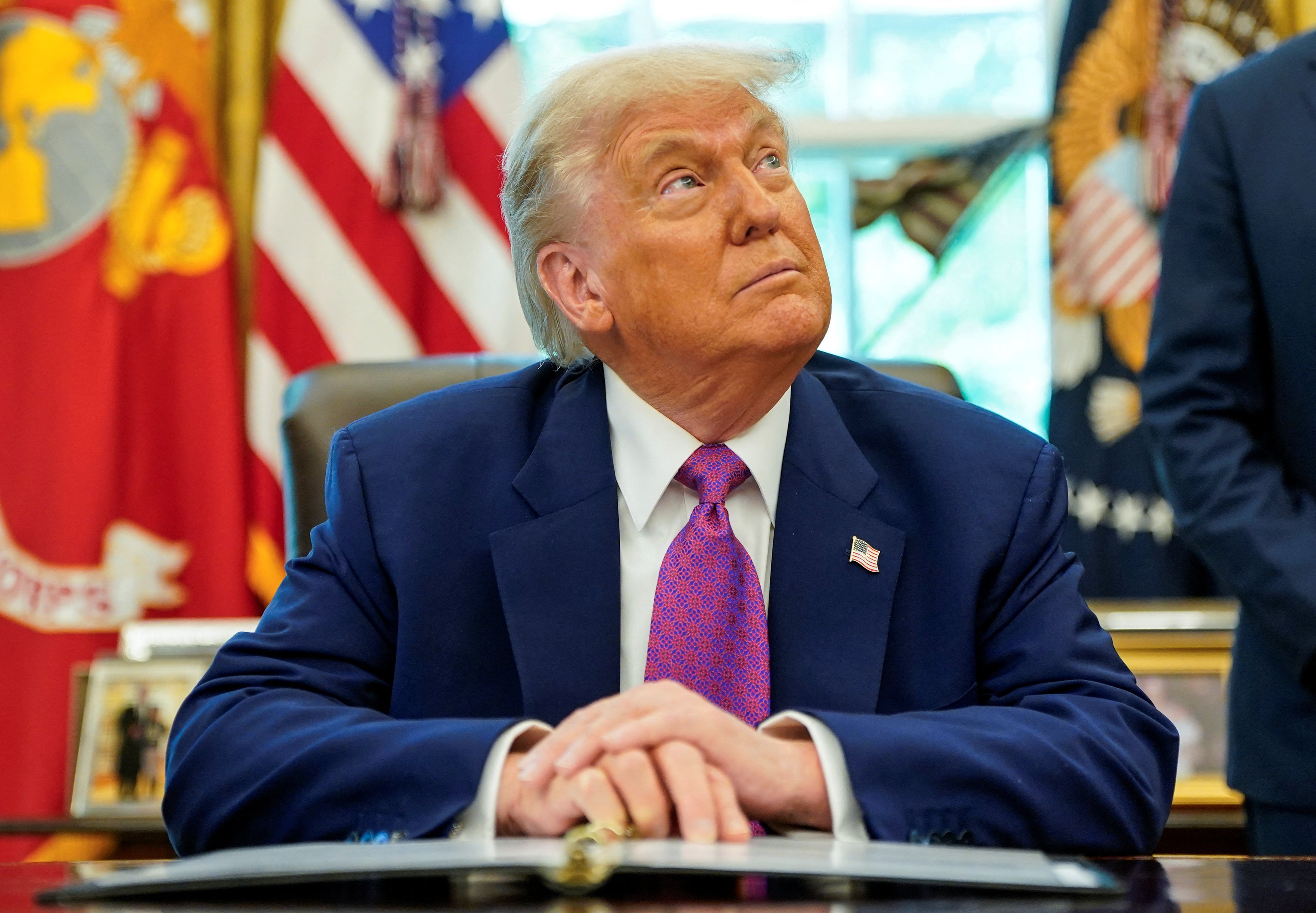 Federal appeals court temporarily reverses decision on Trump’s tariffs