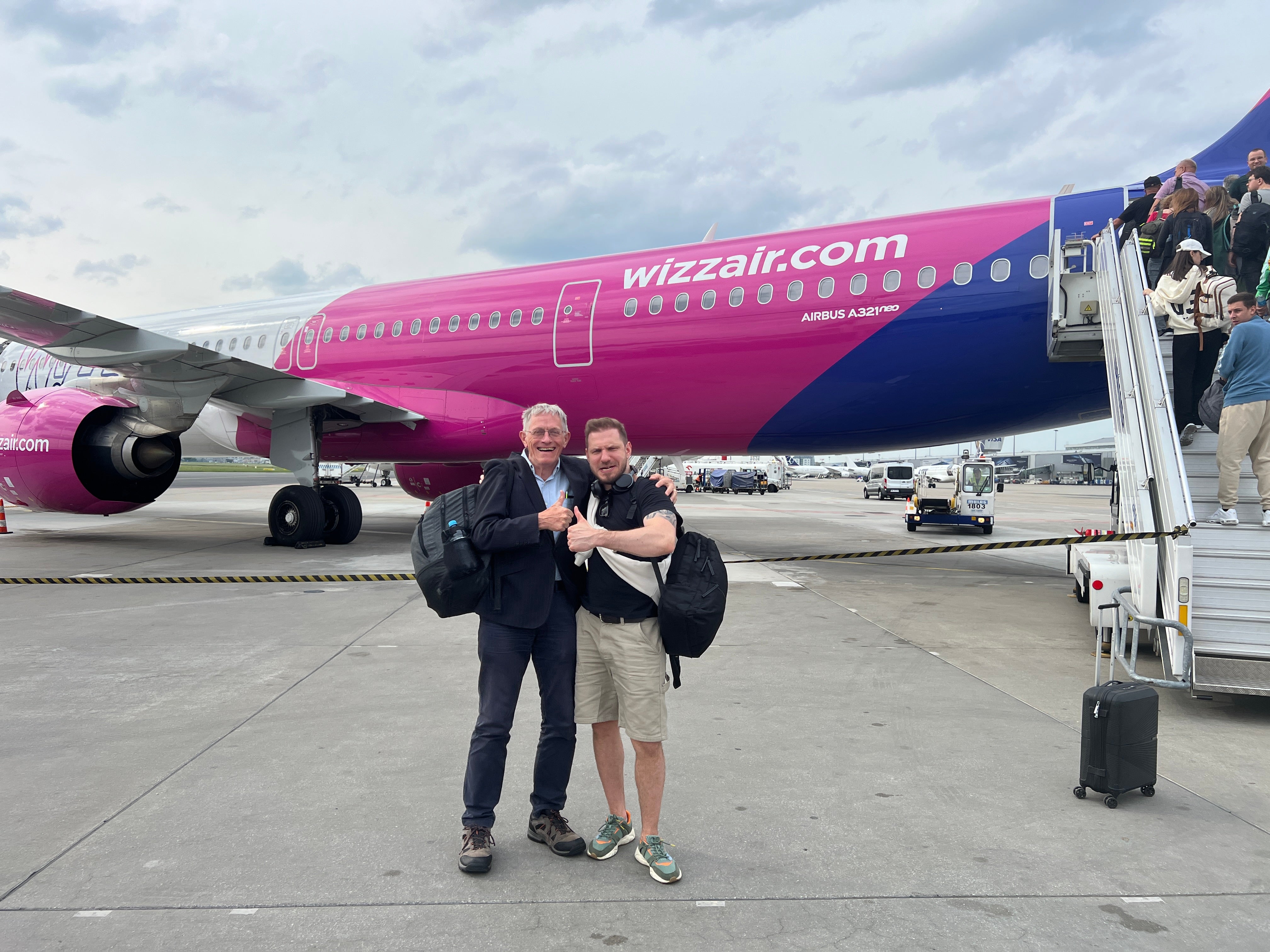 Friendly skies: Simon Calder and friend about to board a delayed Wizz Air flight from Warsaw to Palma