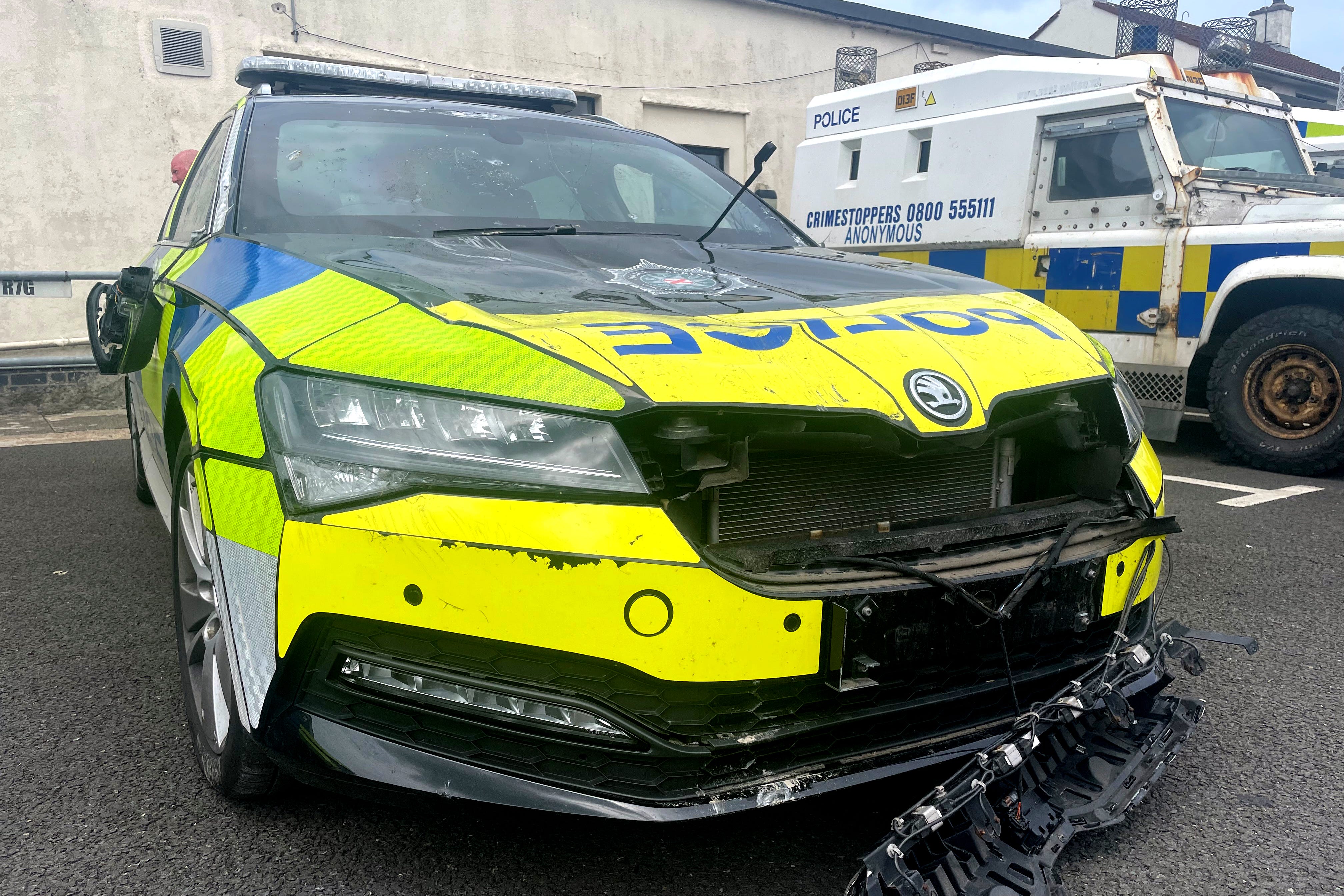 A view of a damaged police car outside Ballymena Police Service of Northern Ireland station (Jonathan McCambridge/PA)