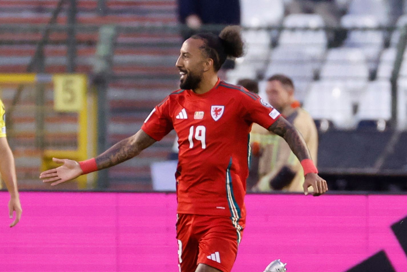 Sorba Thomas celebrates scoring his first goal for Wales against Belgium (Geert Vanden Wijngaert/AP)