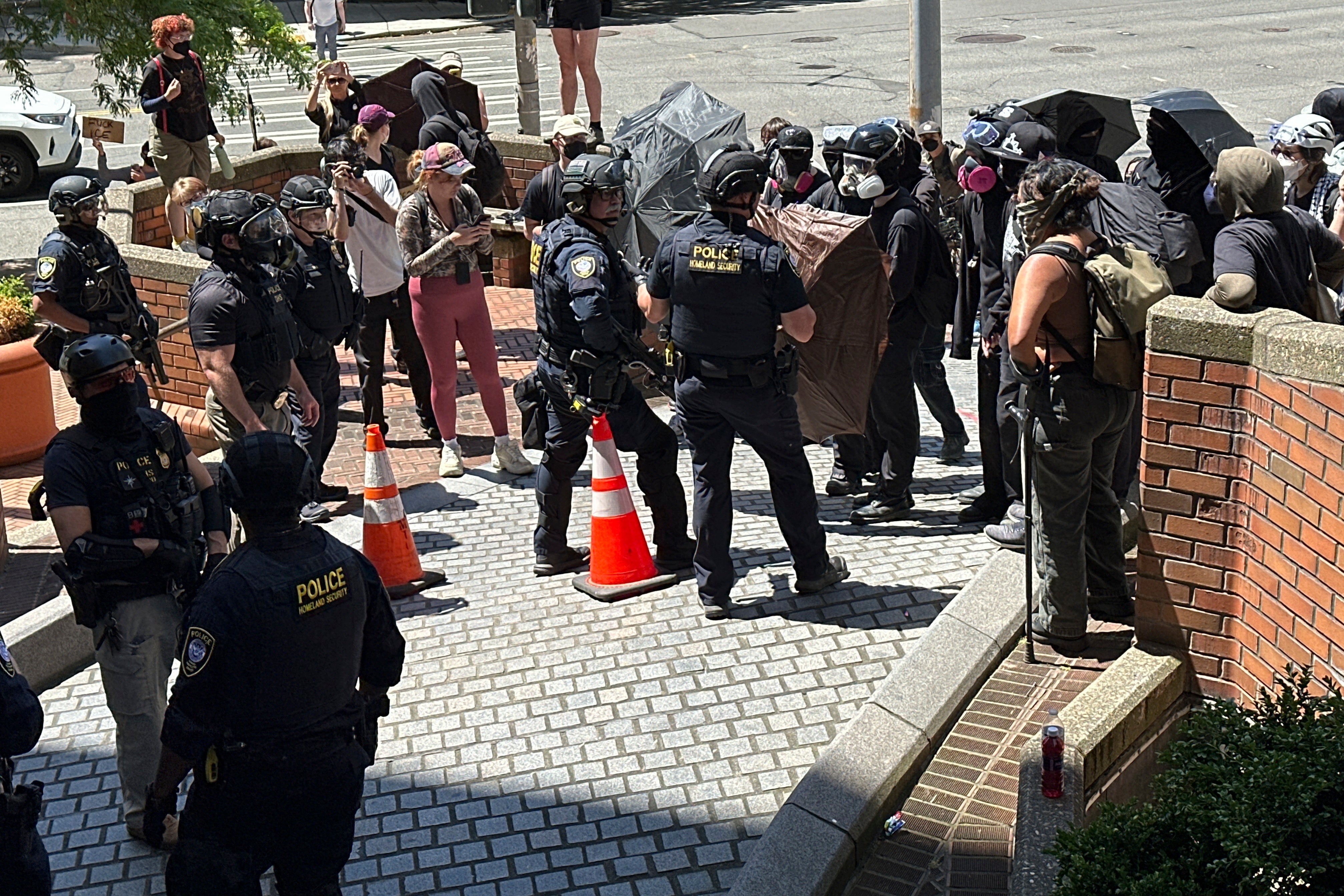 Protests over immigration raids pop up across the US with more planned