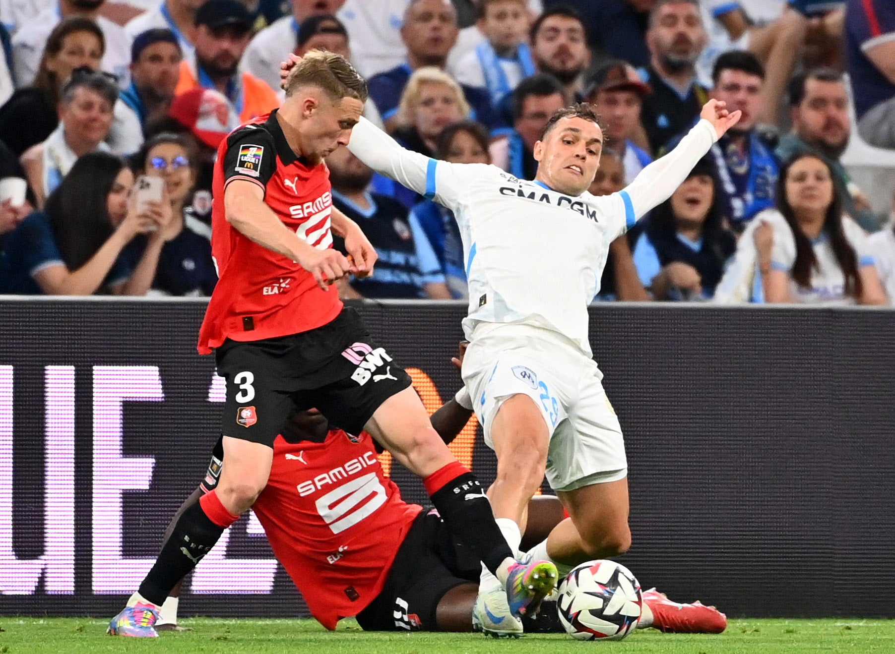 Adrien Truffert, left, in action for Rennes