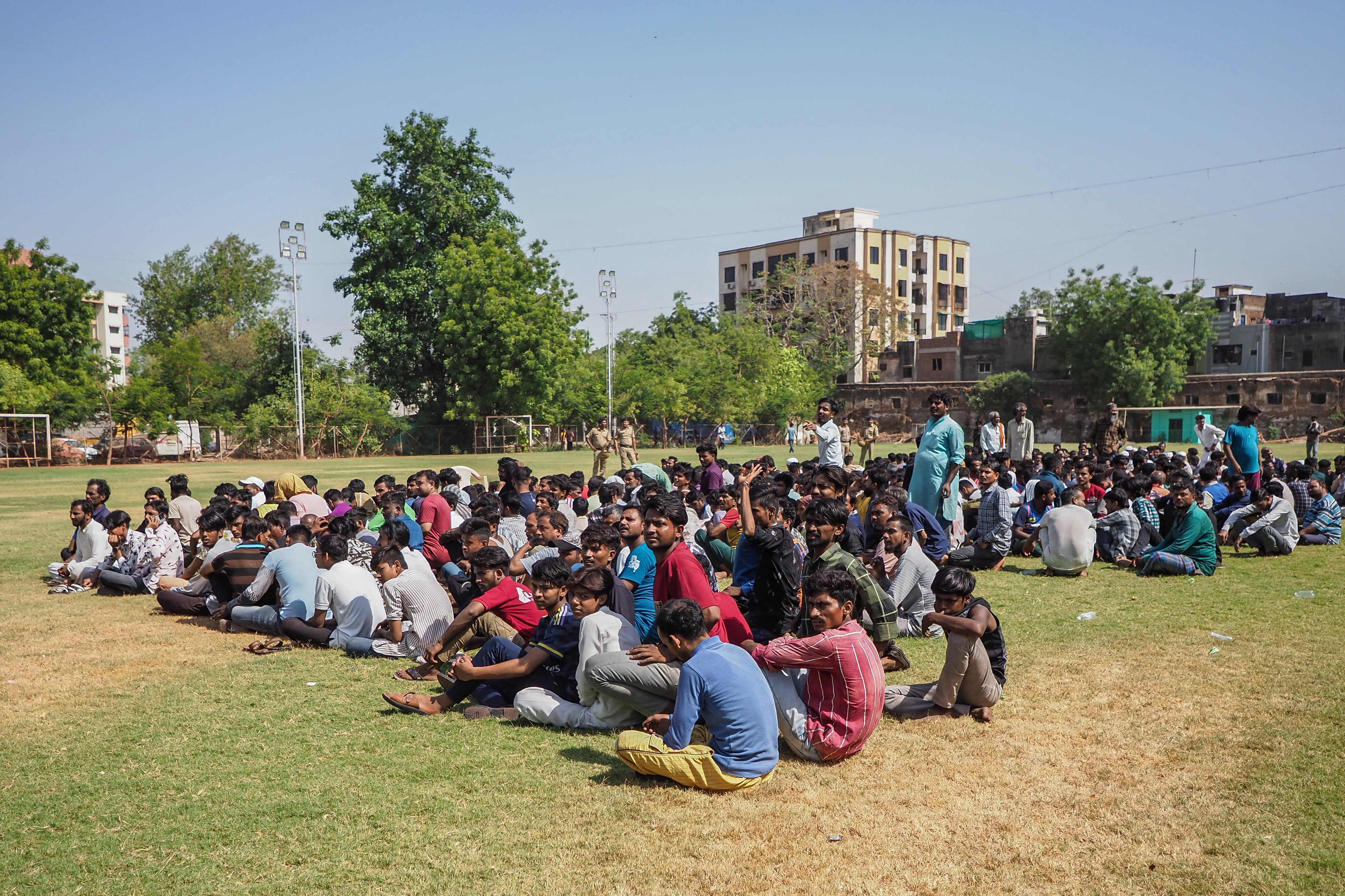 Suspected Bangladeshi migrants detained by police during an overnight operation in Ahmedabad, Gujarat, on 26 April 2025