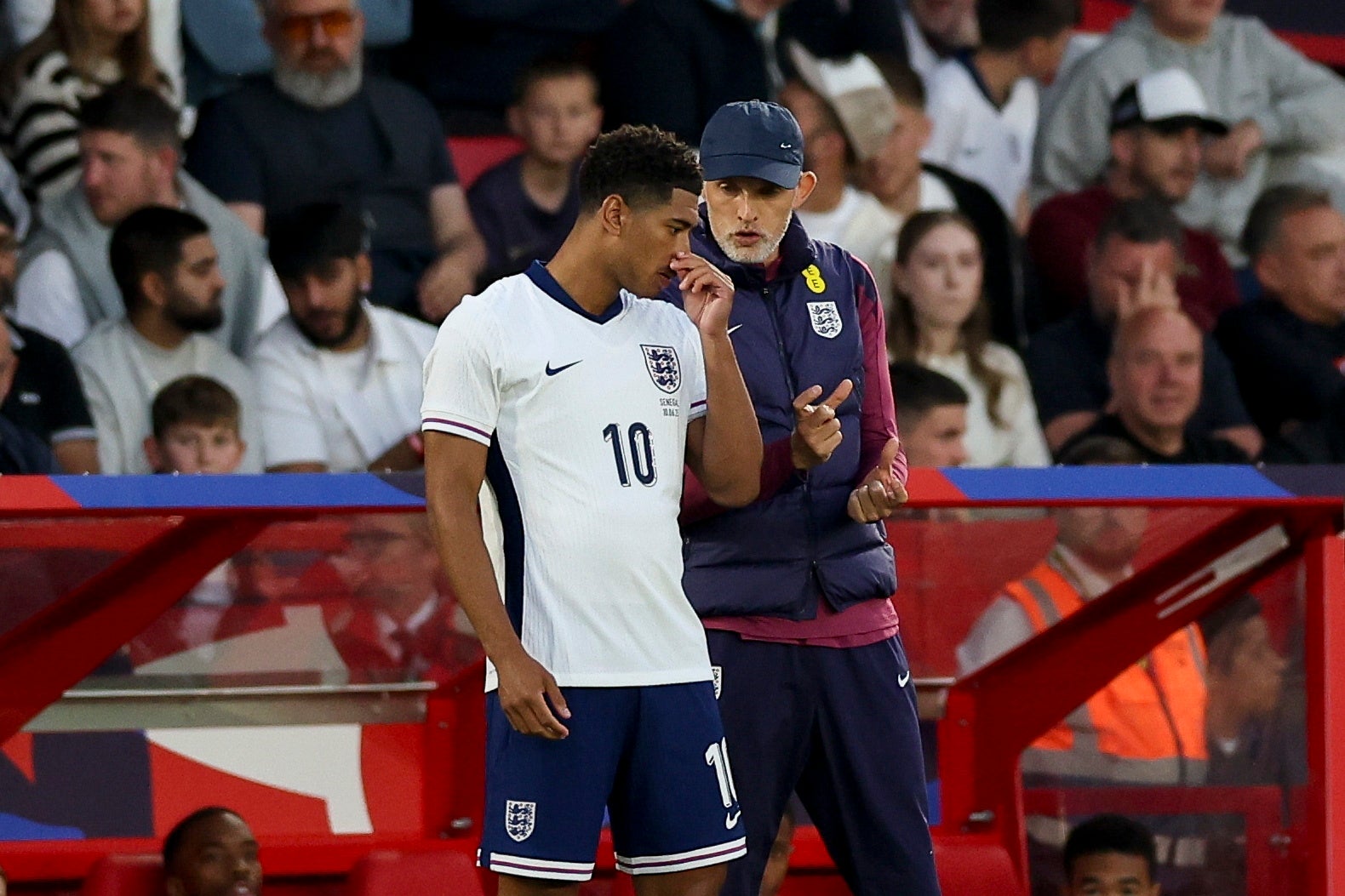Bellingham receives instructions before entering the field of play