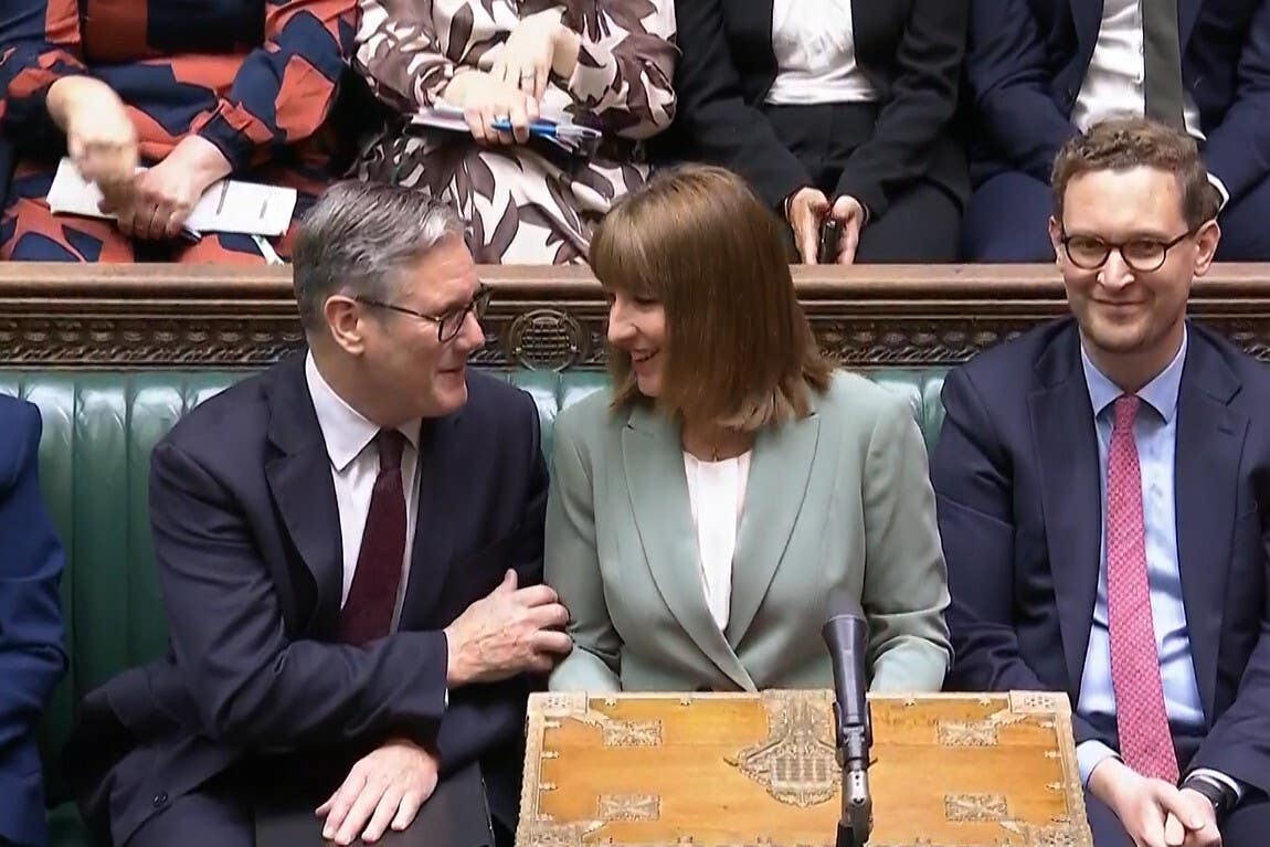 Sir Keir Starmer speaks to Rachel Reeves after she delivered her Government’s spending review to MPs in the Commons on Wednesday (House of Commons/UK Parliament/PA)