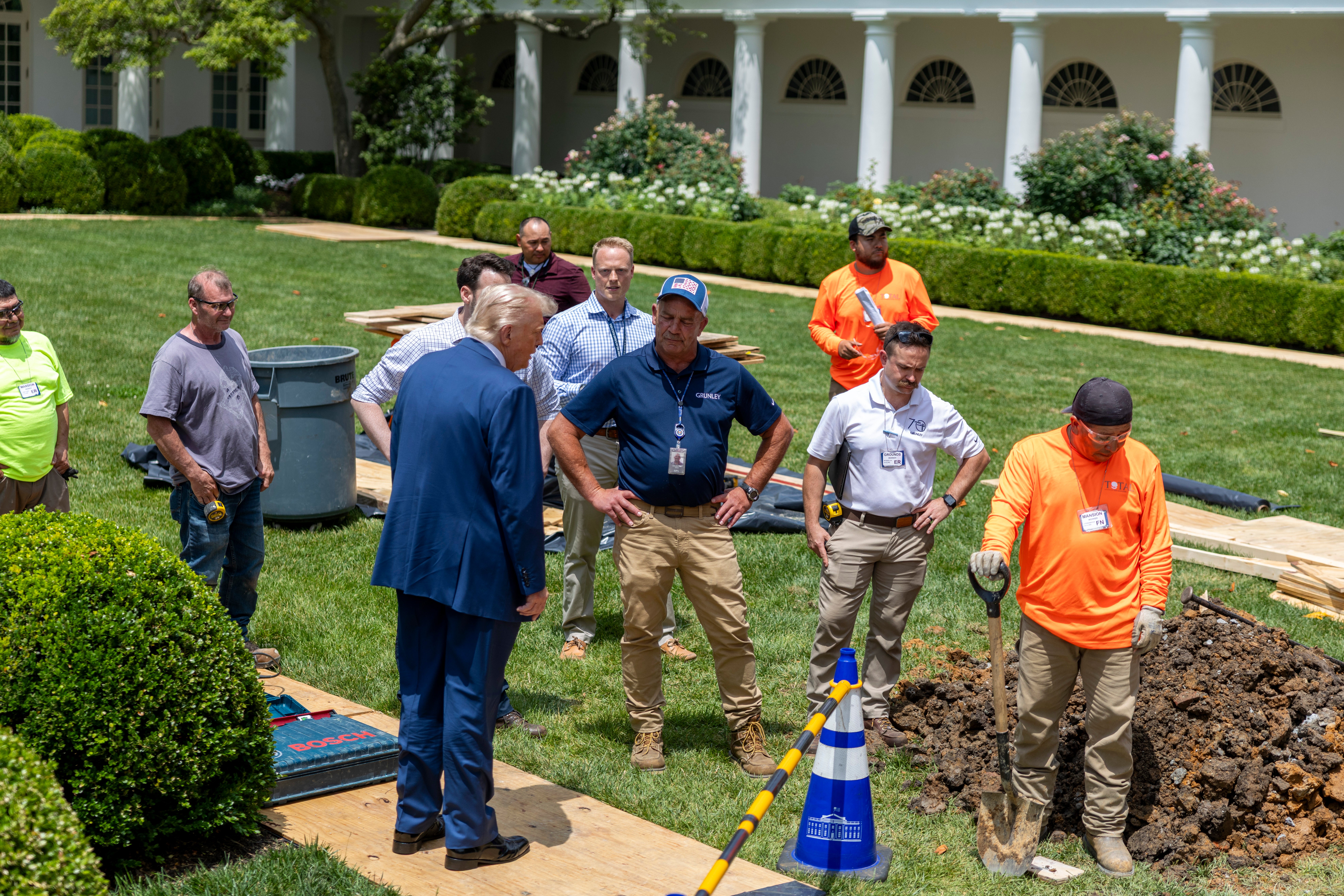 Social media users shared images from June 9, a day after President Donald Trump stumbled, and claimed without evidence that the president is wearing a leg brace. Trump was surveying the construction on the South Lawn