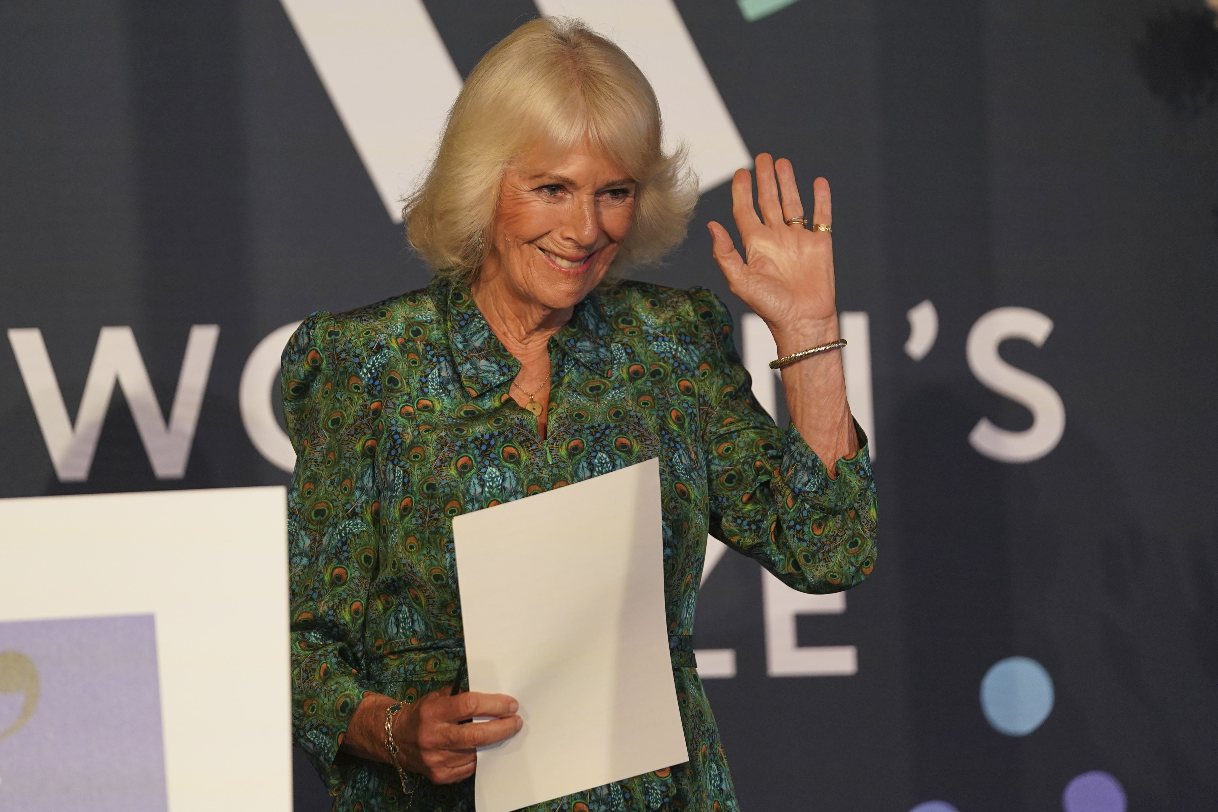 Camilla waves to the audience after delivering a speech at the Women’s Prize for Fiction and Non-Fiction event in London (PA)