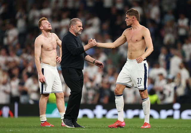 <p>Ange Postecoglou (right) shaking hands with Micky van de Ven</p>