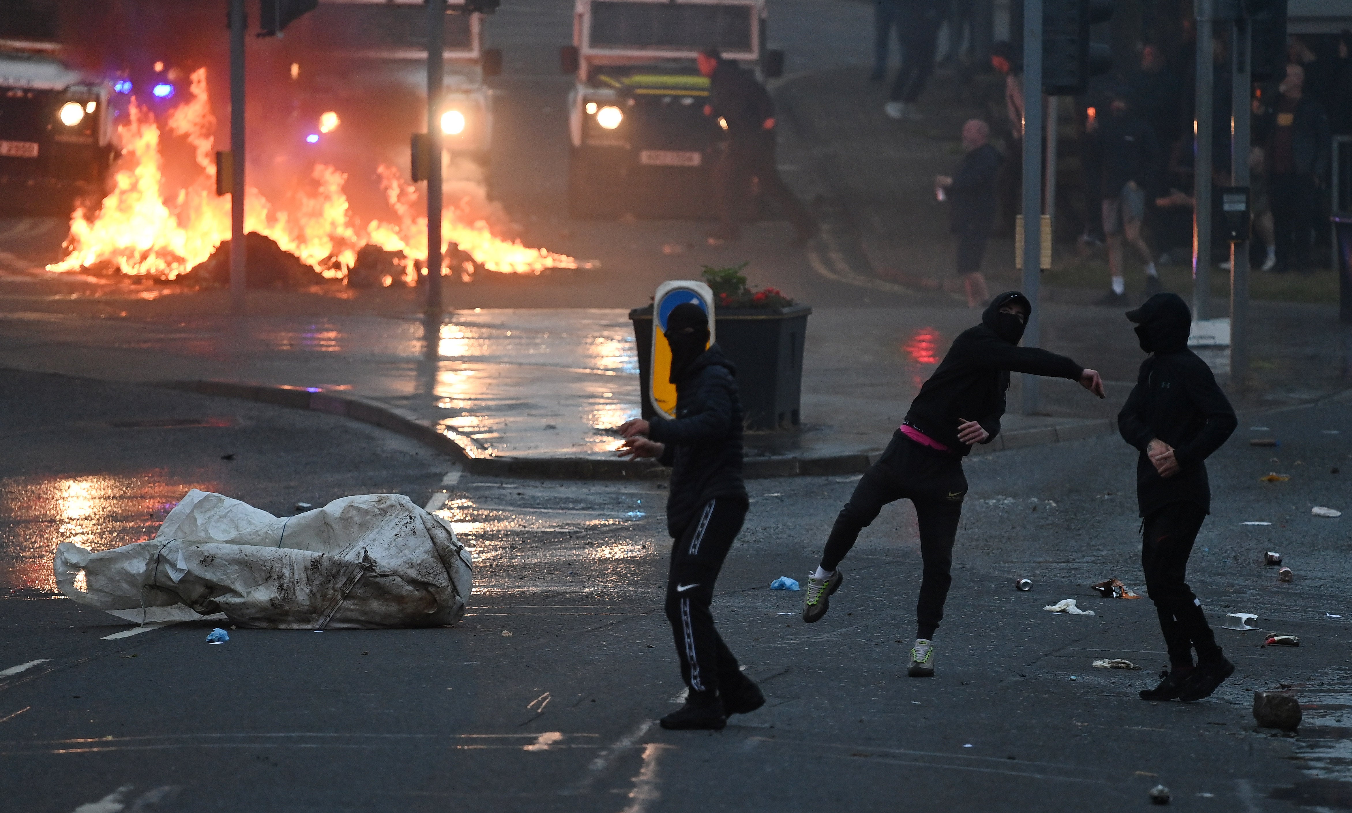 Some masked protesters shouted abuse and threw objects at the police, including fireworks, glass bottles and pieces of metal