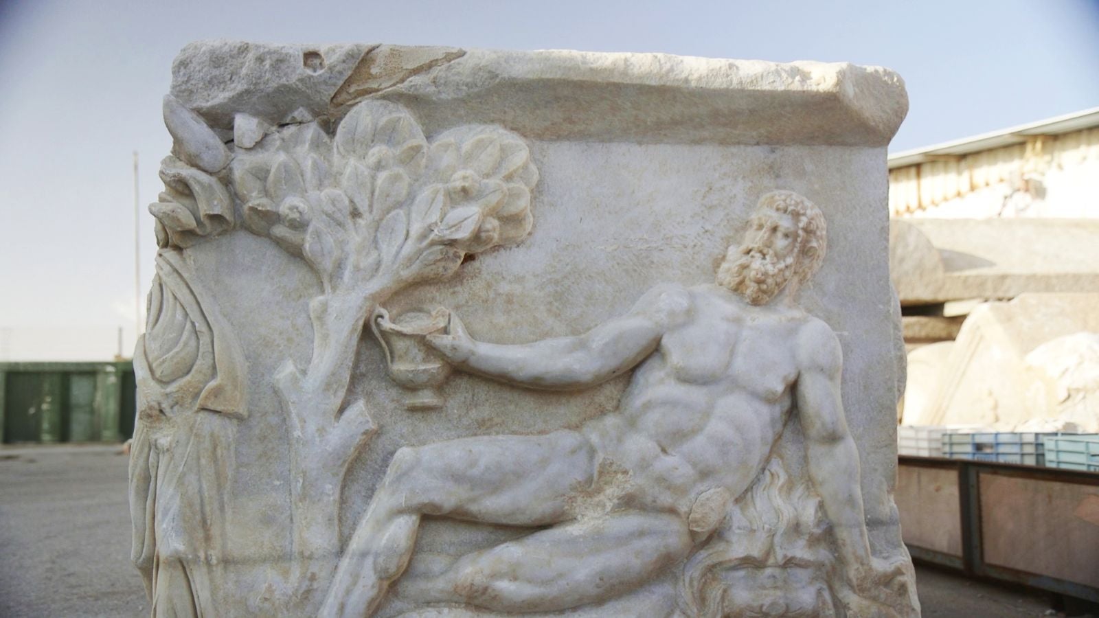 Marble sarcophagus depicting Hercules holding a cup