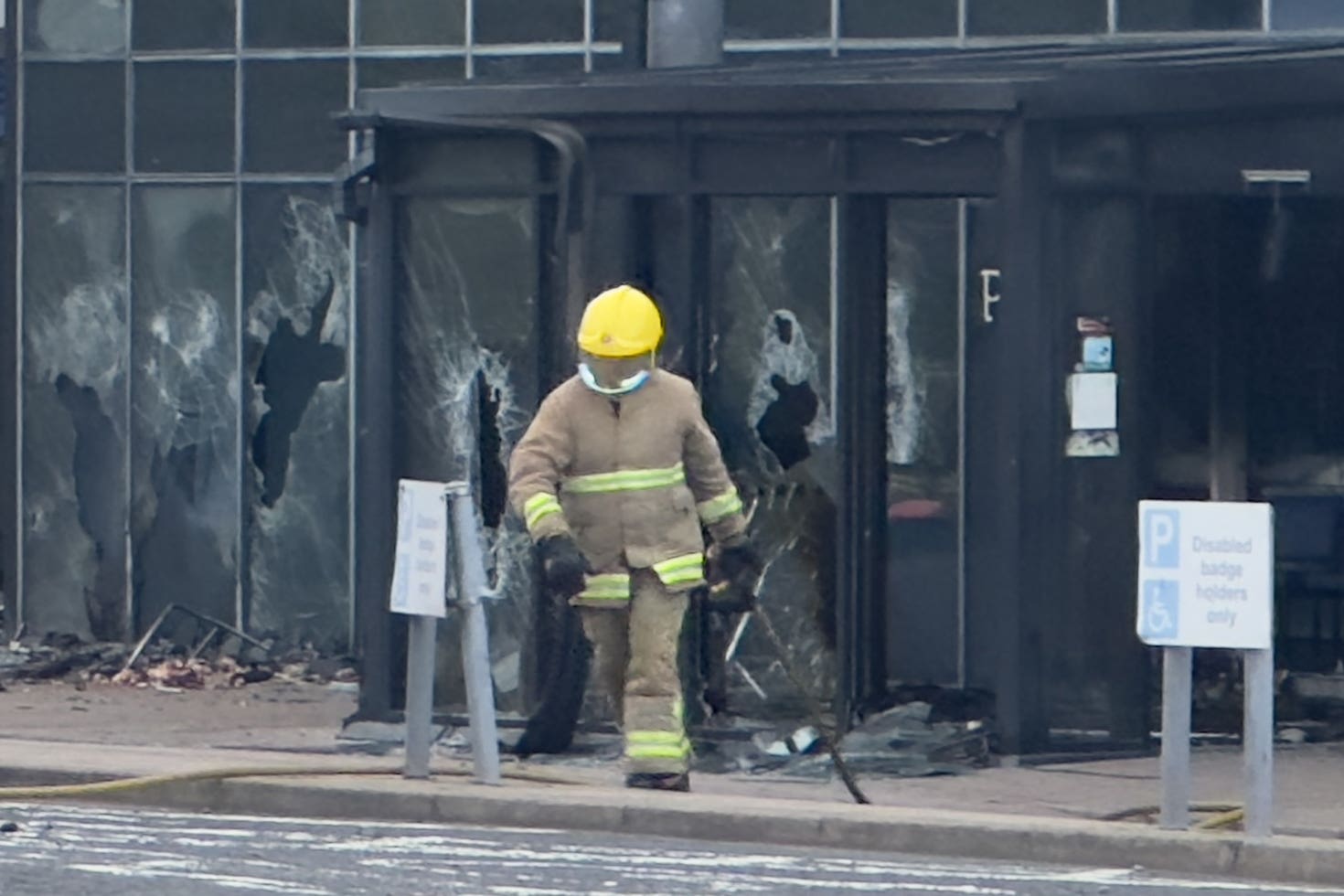 A firefighter outside Larne Leisure Centre (Liam McBurney/PA)