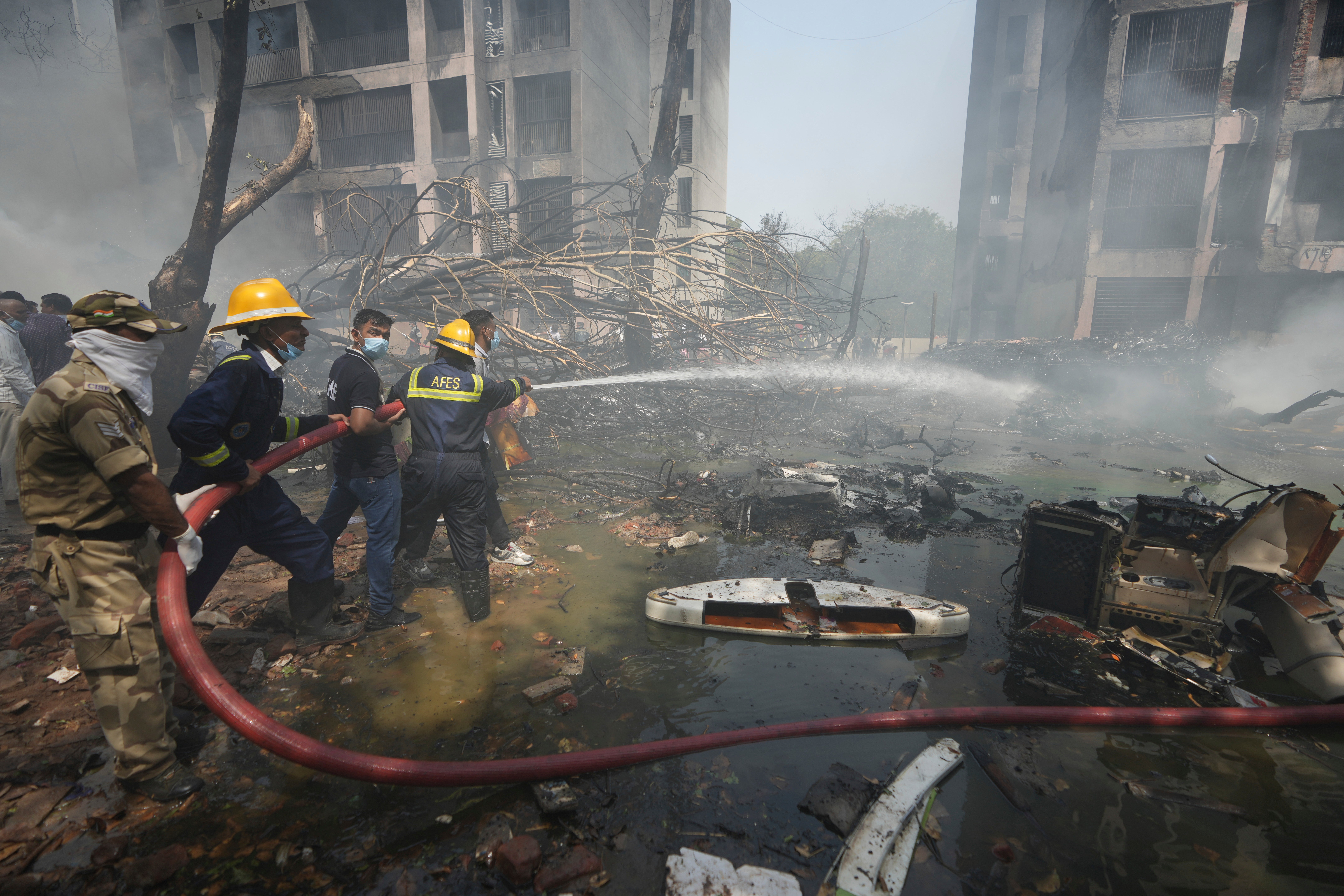 Fires broke out around the medical hostel after the crash, with emergency teams arriving to put out the flames