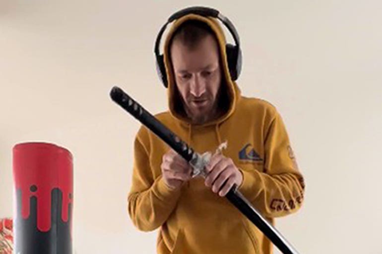 Marcus Arduini Monzo with a samurai sword that was shown to the jury in his trail at the Old Bailey (Metropolitan Police/PA)