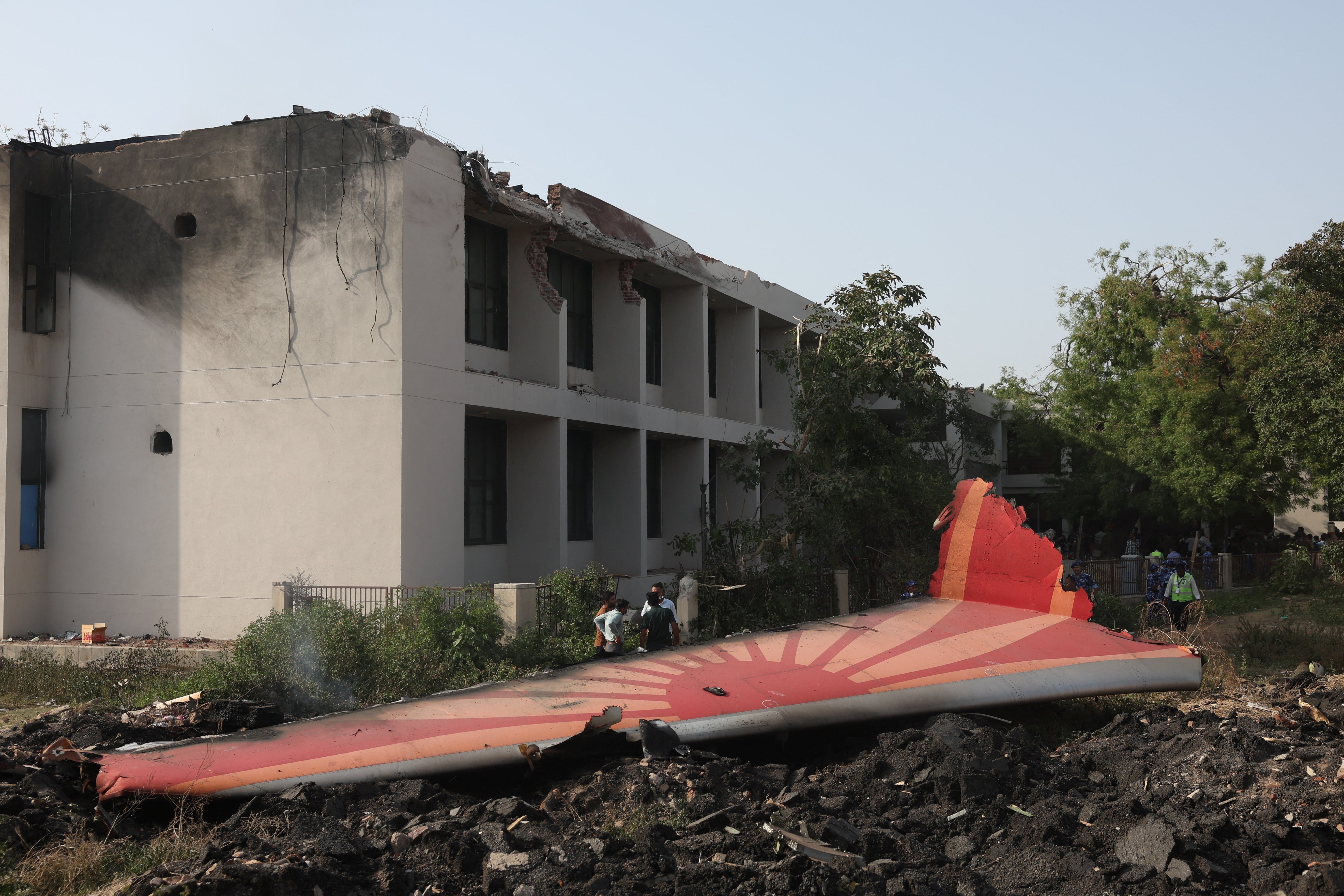 Wreckage from the plane lies on the floor next to the hostel building