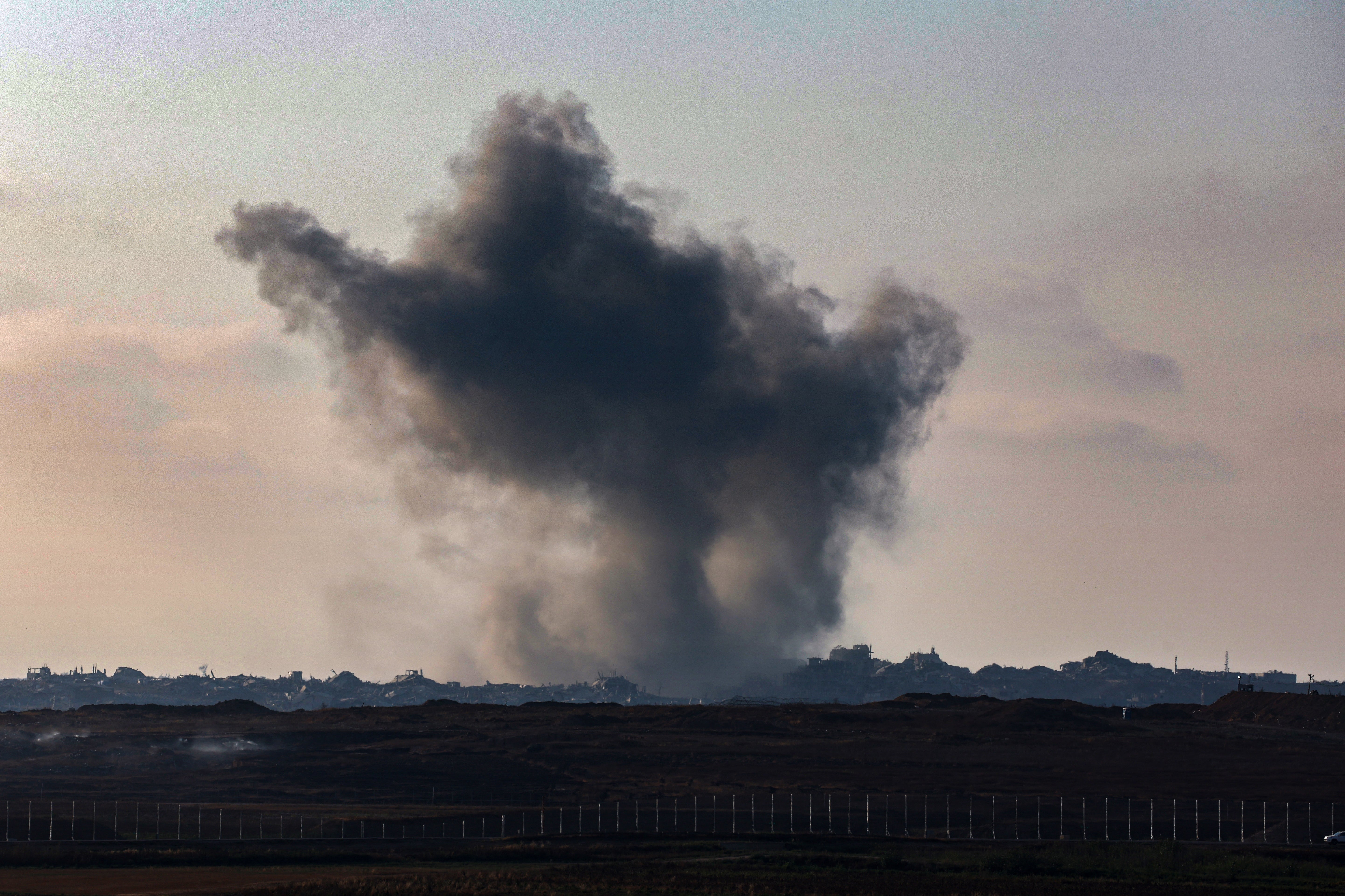 Smoke billows after an Israeli strike on Gaza on 11 June 2025