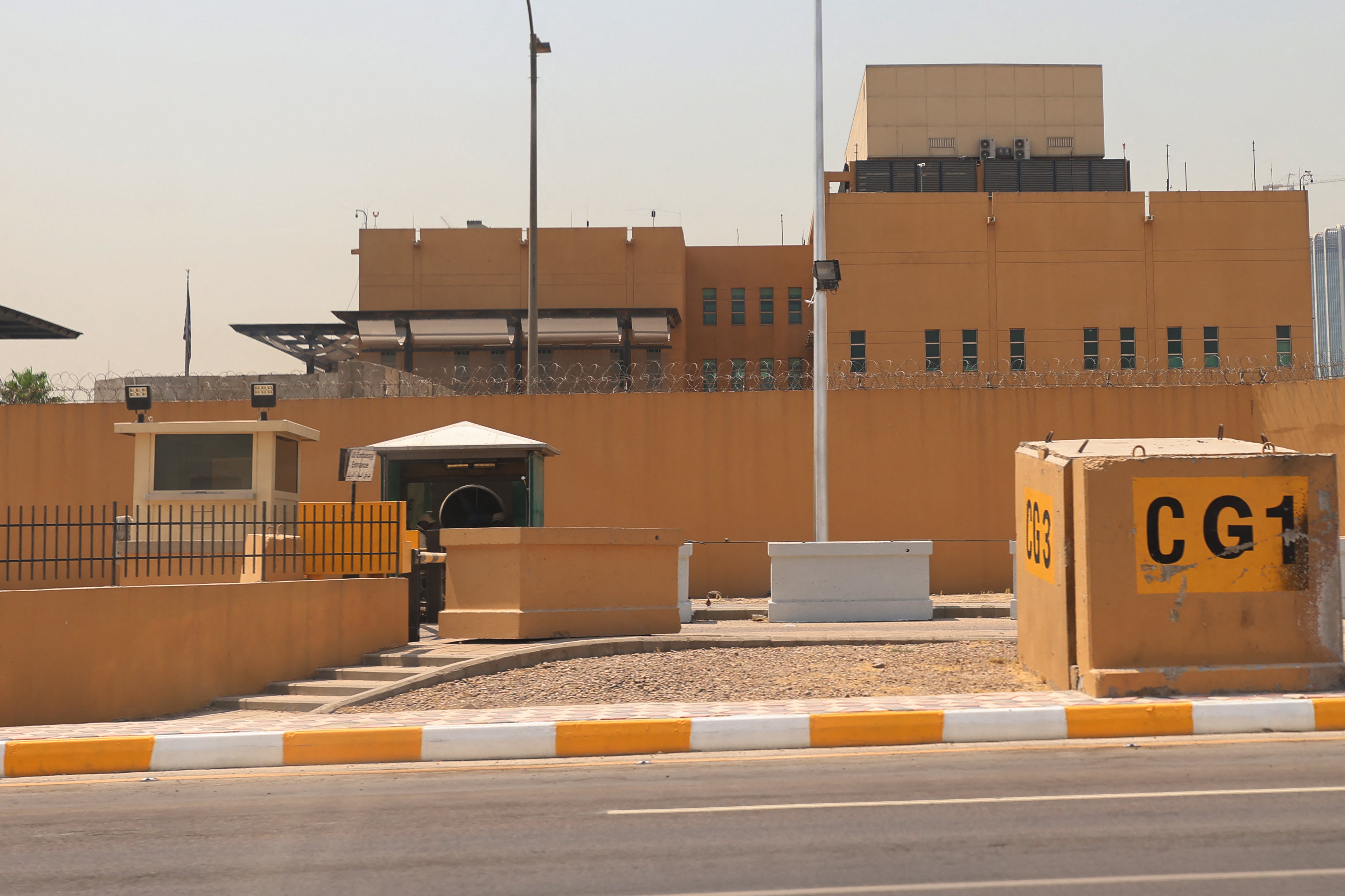 An empty road in front of one of the entrances of the US embassy building in Baghdad's Green Zone, after the US announced it was withdrawing some personnel, 12 June 2025
