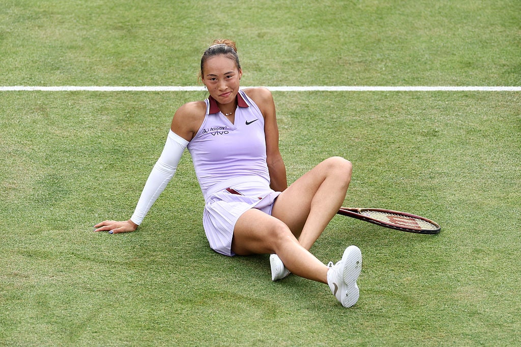 Zheng was left on the turf by a Raducanu drop shot but still claimed the set