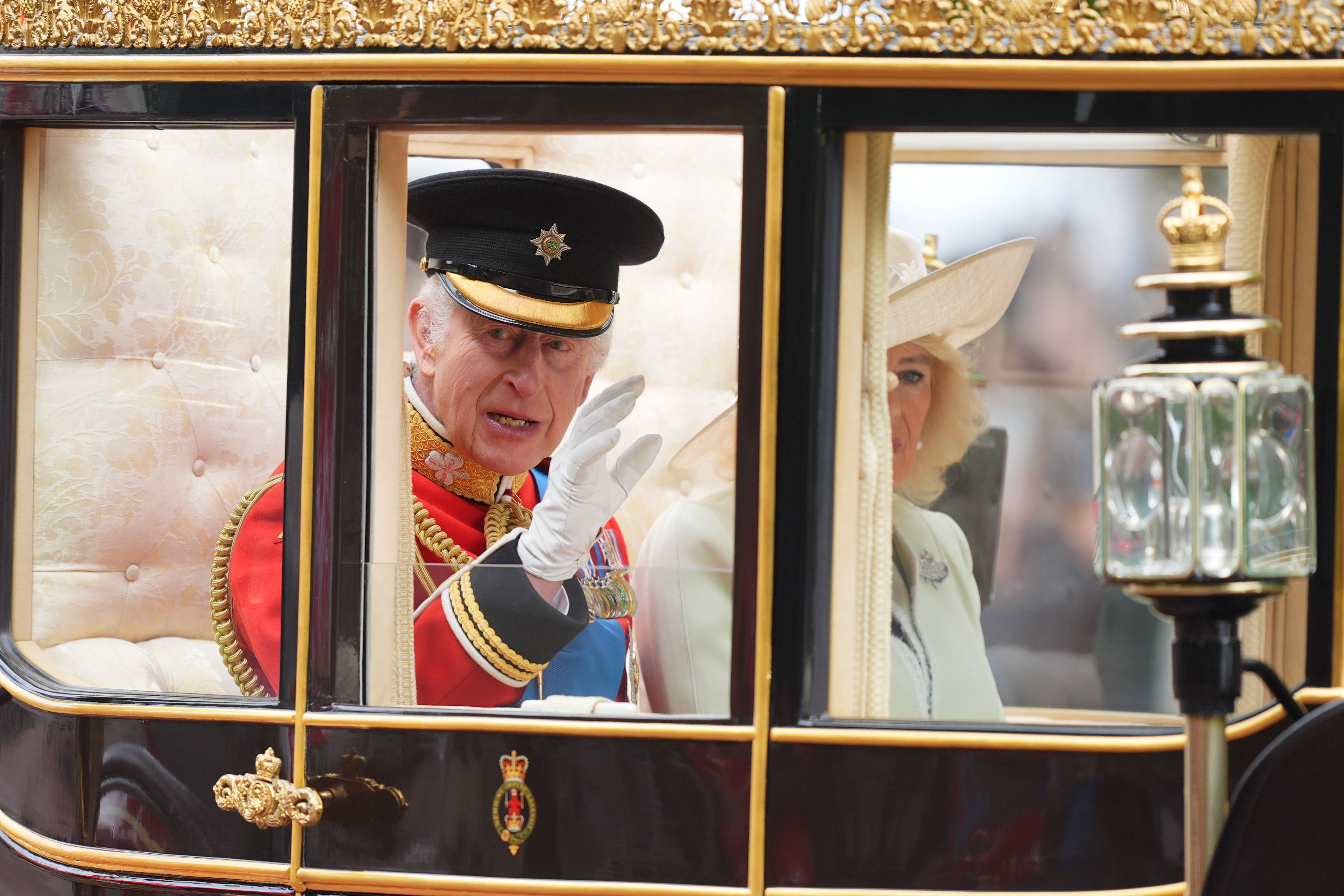 The King and Queen travelling to the Trooping the Colour ceremony last year