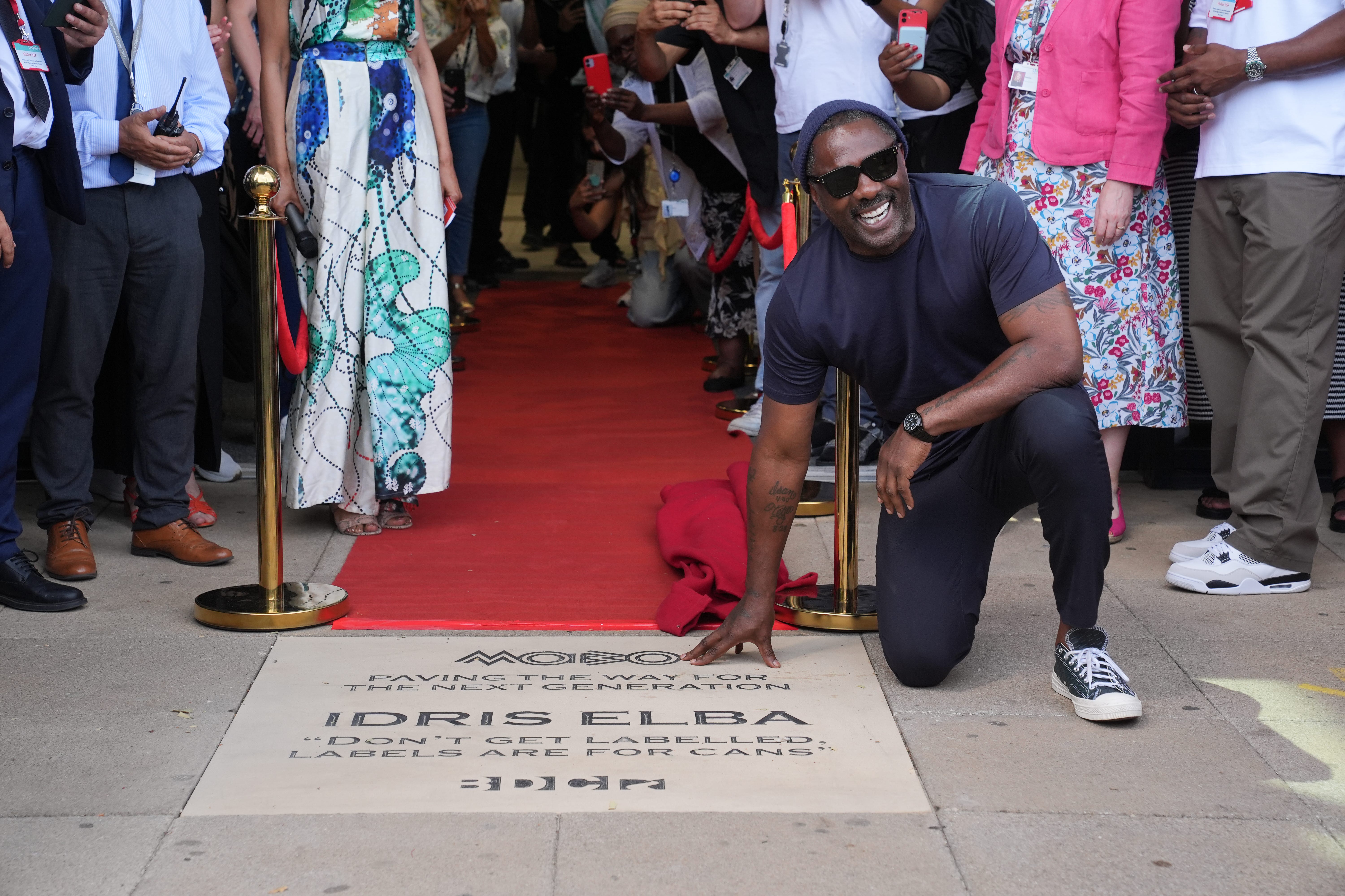 Idris Elba during a visit to Barking and Dagenham College, London, which he used to attend, to lay a commemorative MOBO ‘Paving the Way’ stone (Lucy North/PA)