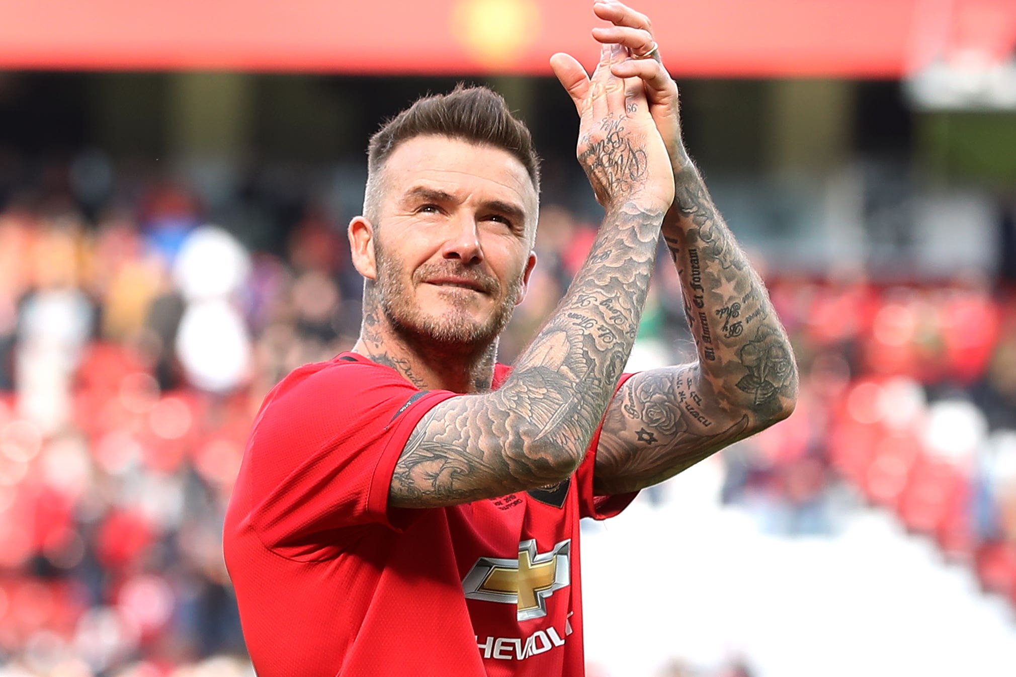 David Beckham applauds Manchester United fans at Old Trafford (Martin Rickett/PA).