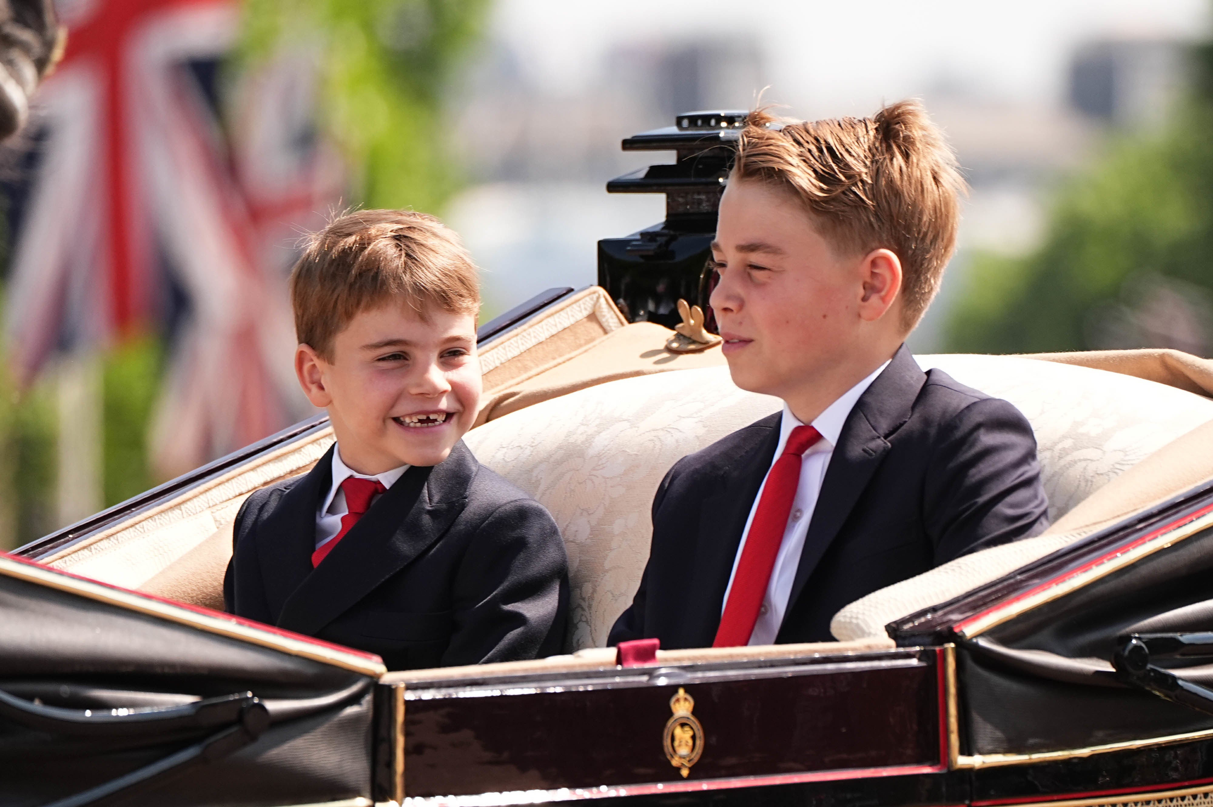 Prince Louis (left) and Prince George were seated with their mother and sister