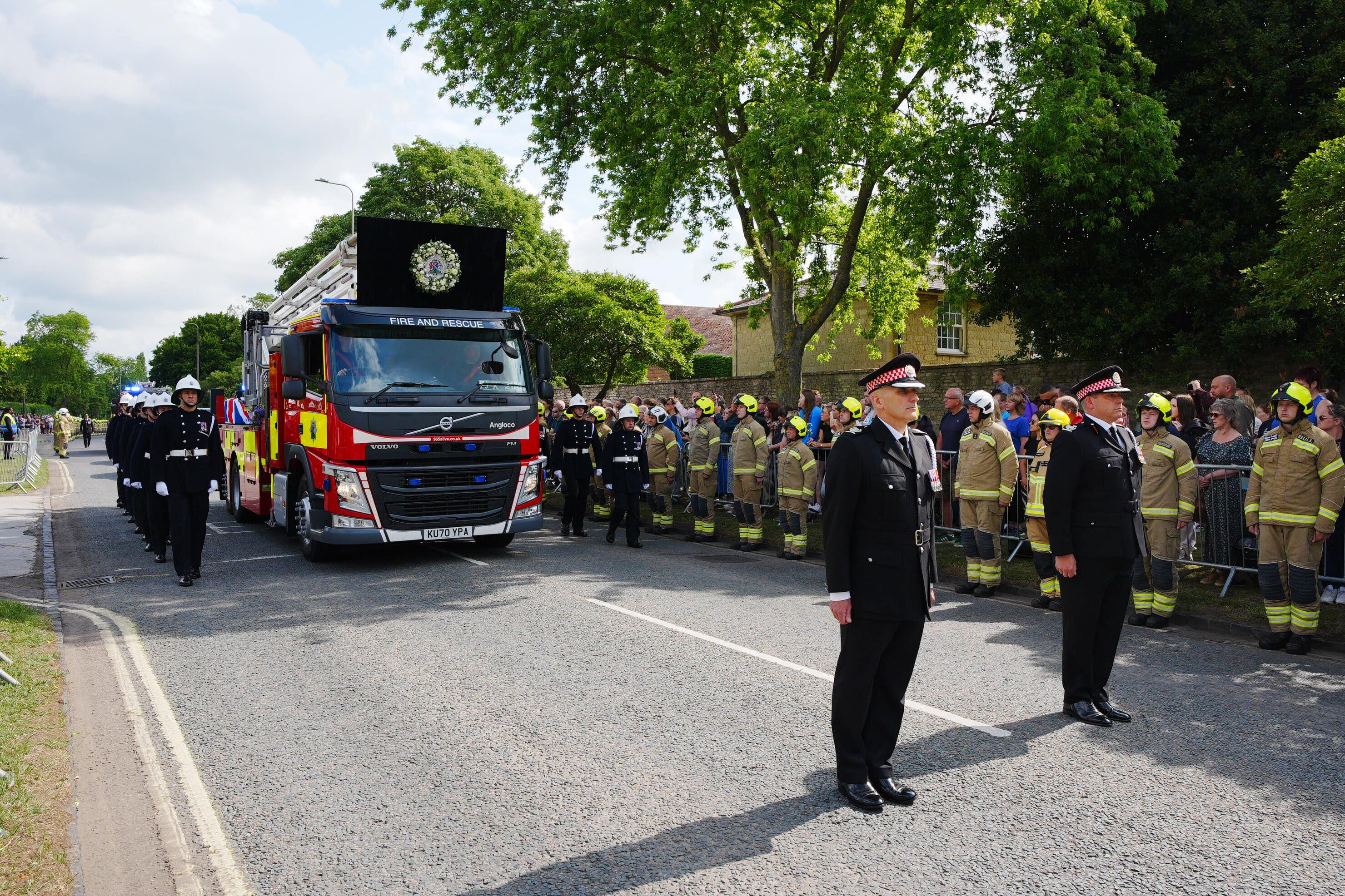 The cortege passing Bicester fire station (Ben Birchall/PA)