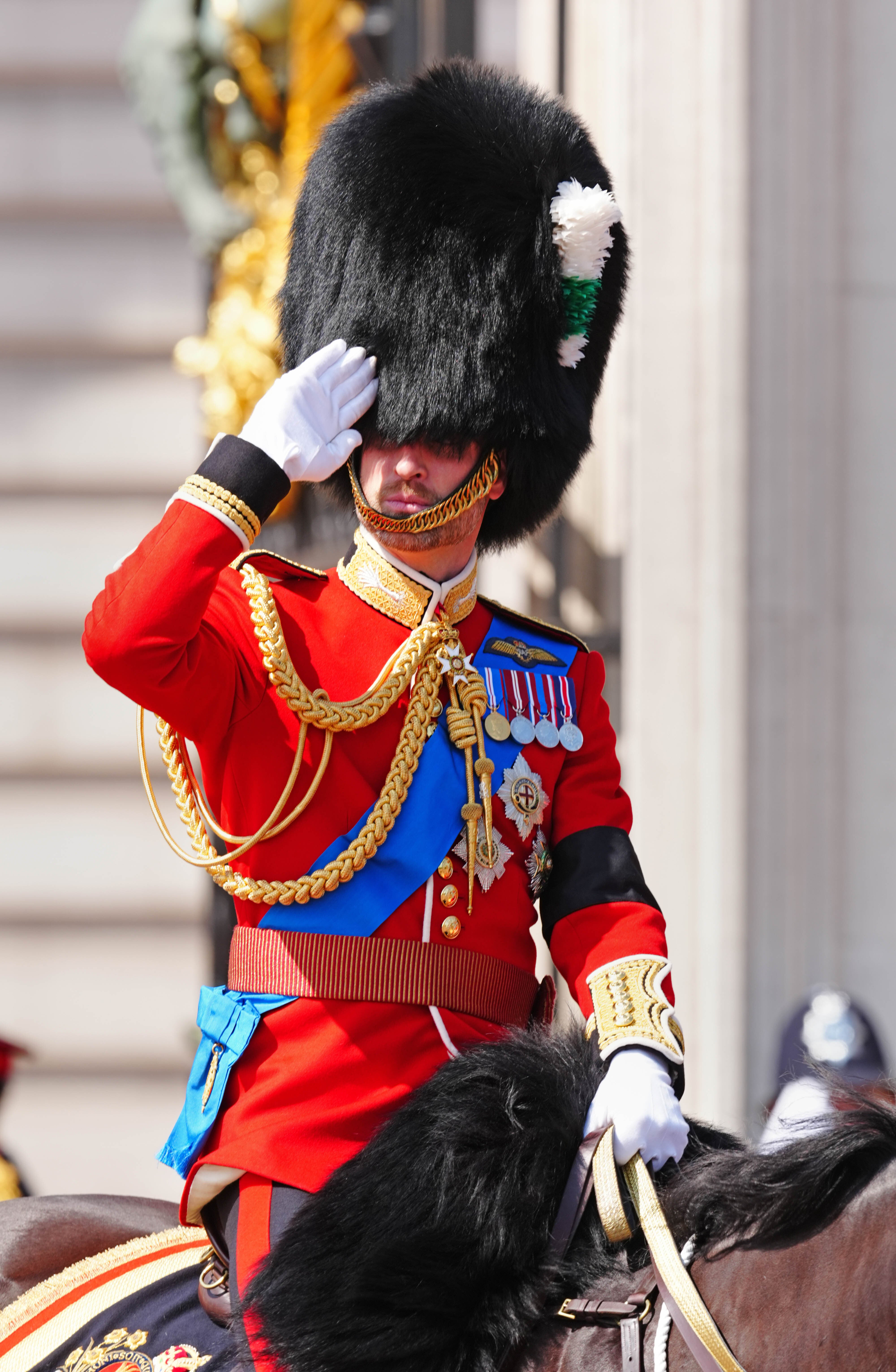 The Prince of Wales salutes his father on horseback