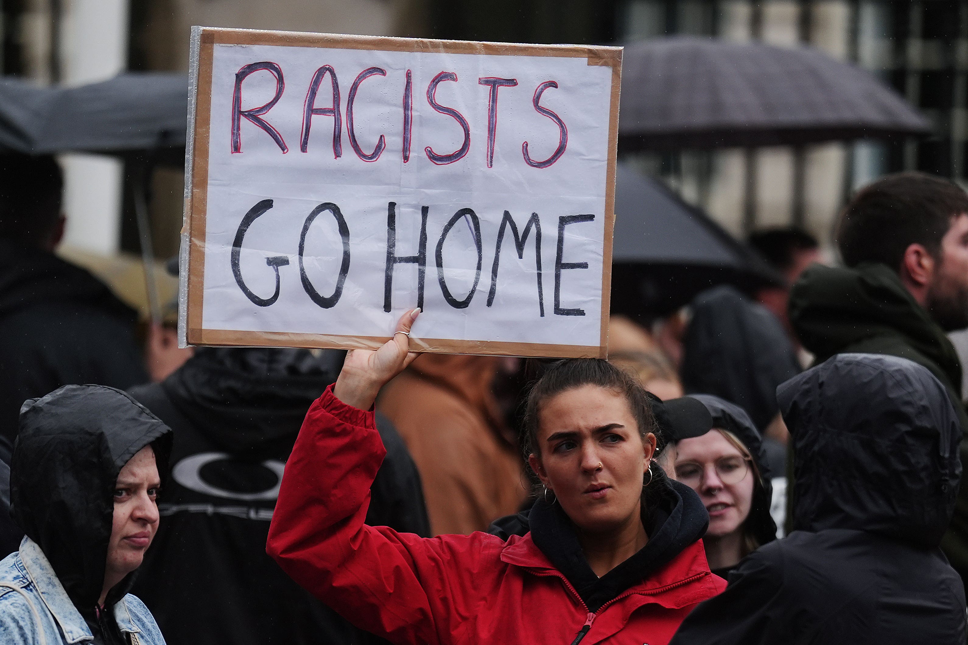 Demonstrators take part in a United Against Racism rally at Belfast City Hall (Brian Lawless/PA)