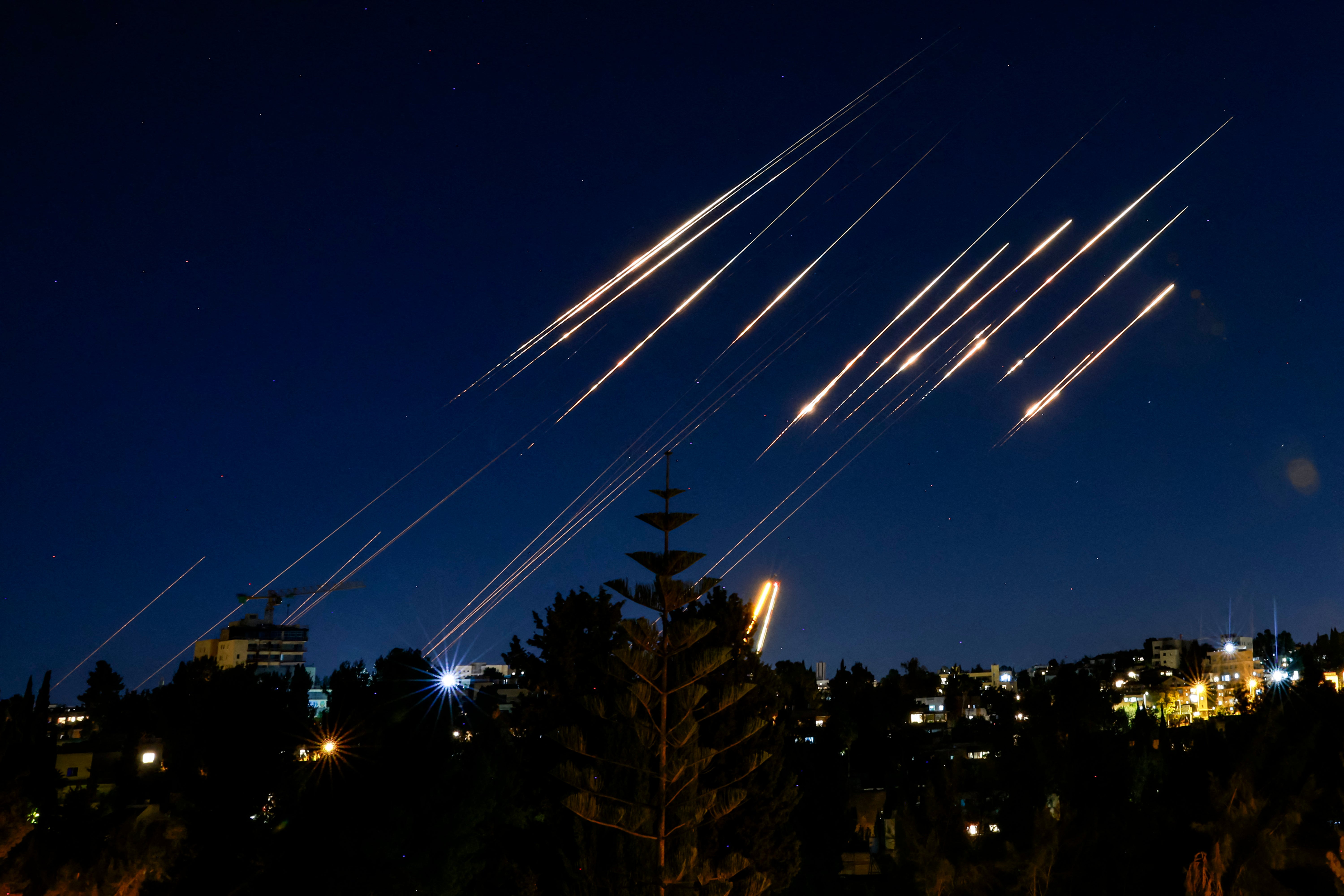 Missiles fired from Iran are pictured in the night sky over Jerusalem on 14 June