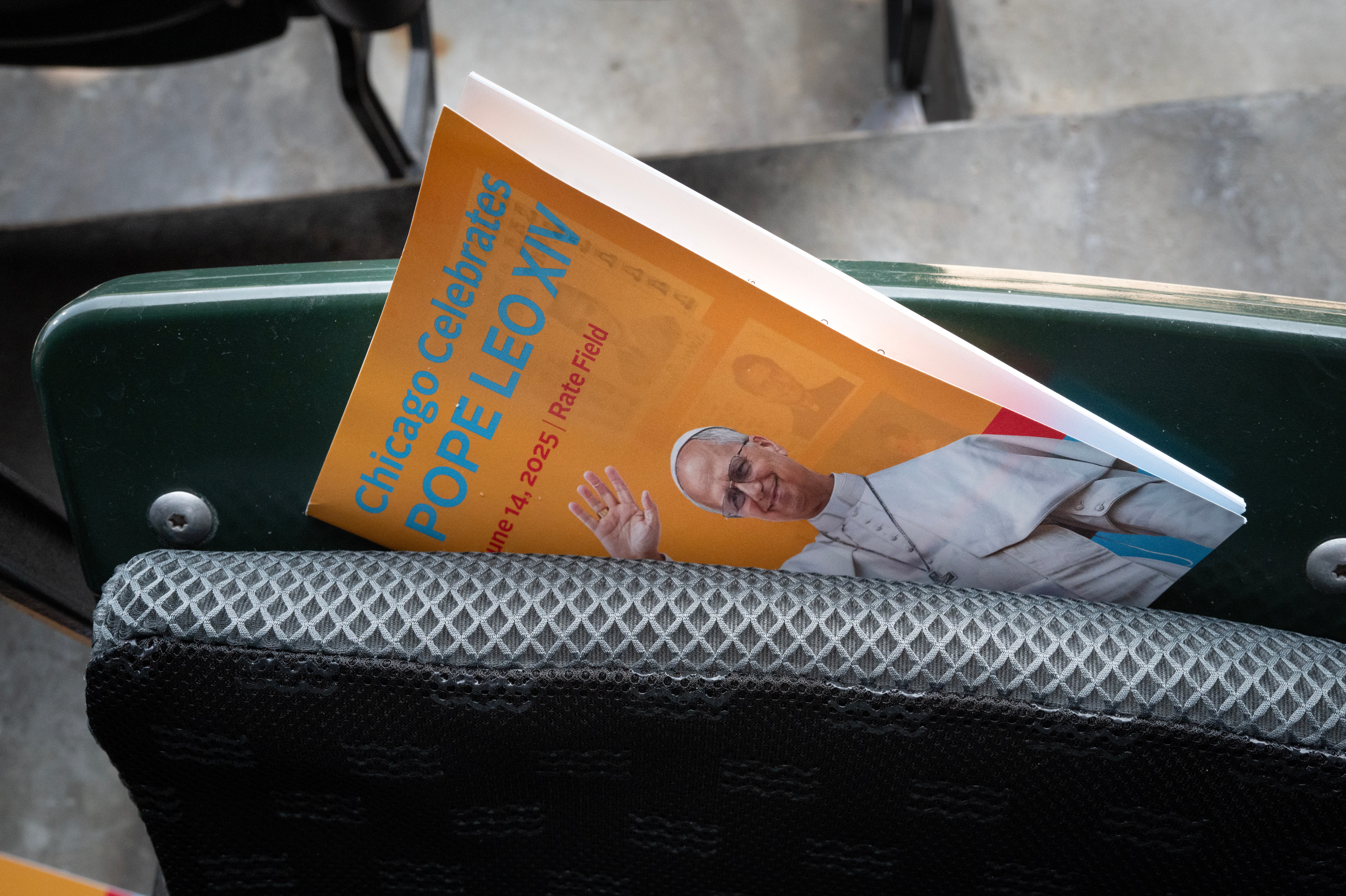 A program is stuffed into a seat at Rate Field, home to the Chicago White Sox, where the pope addressed the US for the first time since he was elected