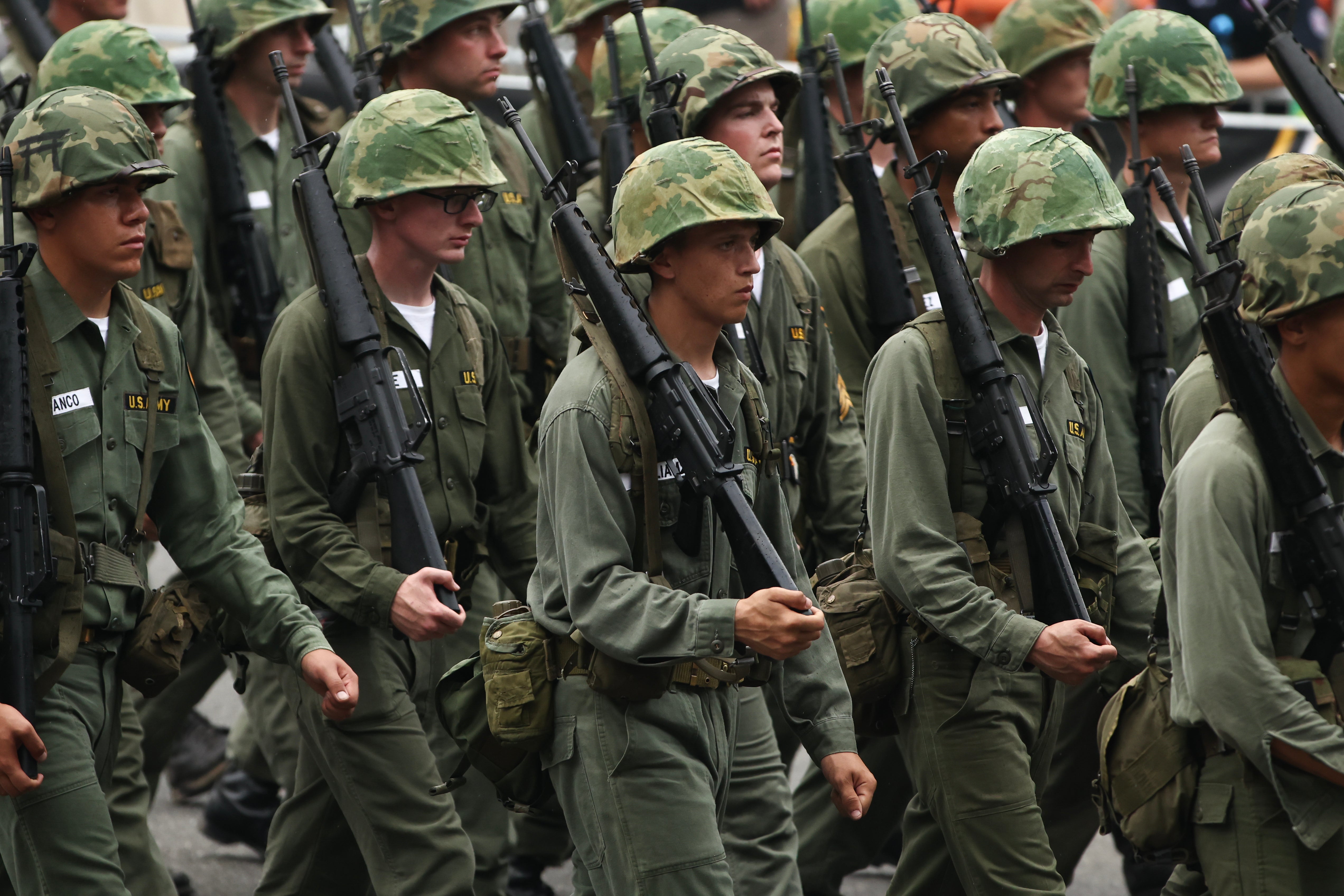 Soldiers dressed in Vietnam War uniforms
