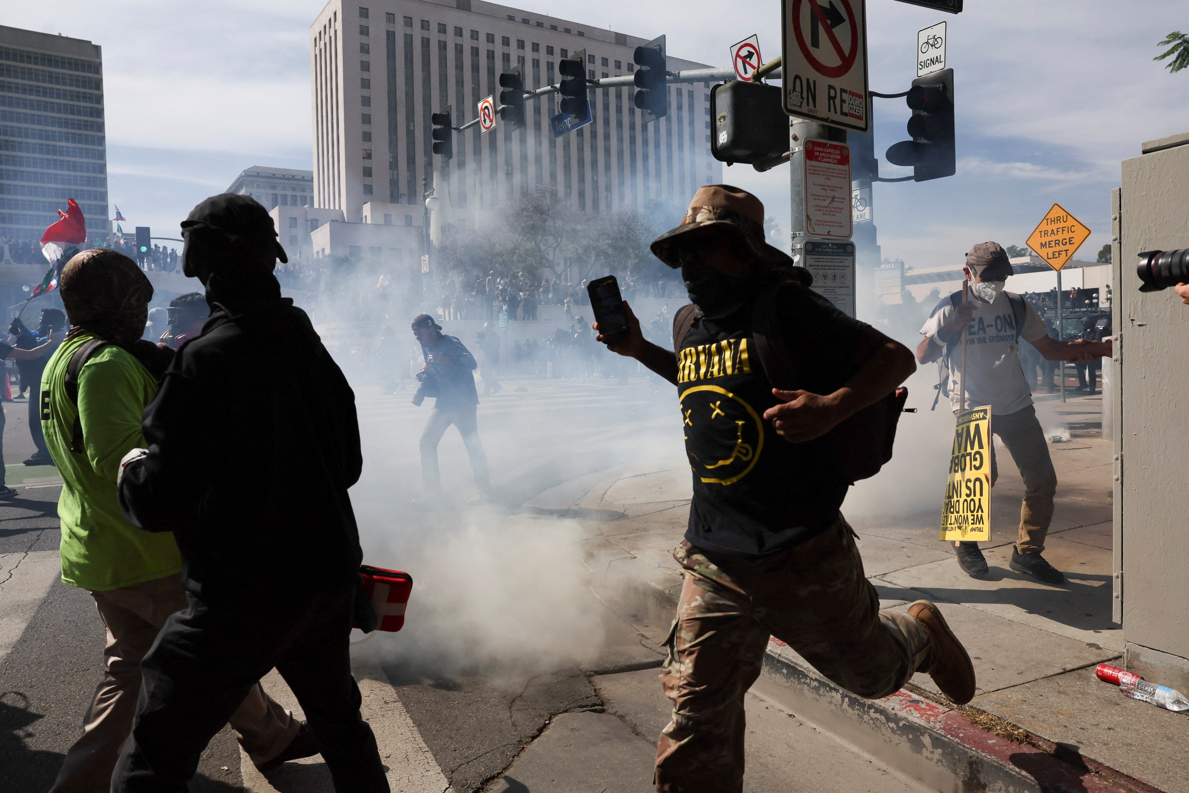 A dispersal order was issued for a crowd outside a federal building complex in Los Angeles as photos from the scene showed protesters fleeing officers.