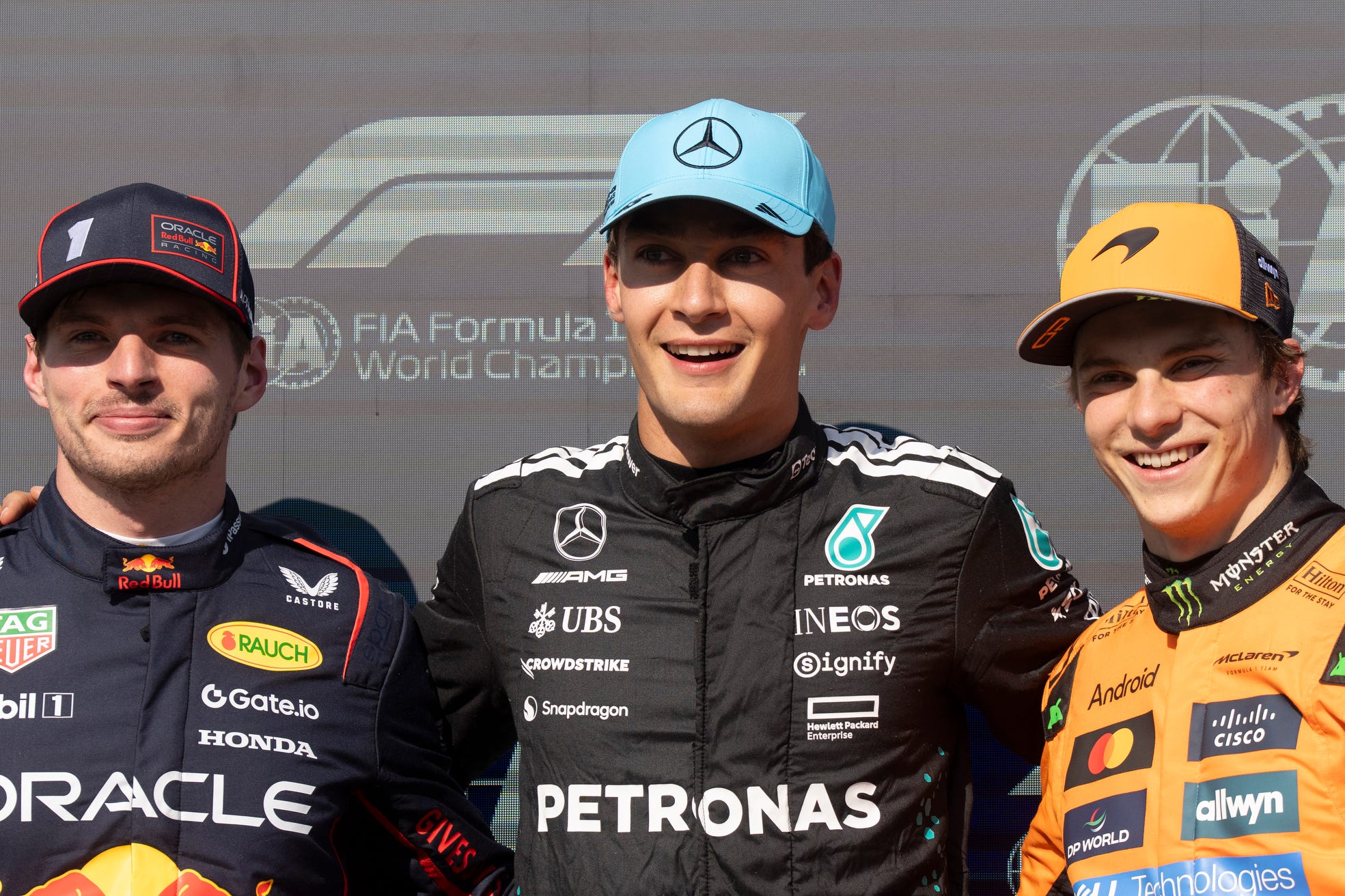 Max Verstappen (left) lashed out at criticism of his driving as George Russell (centre) took pole in Canada (Christinne Muschi/AP)