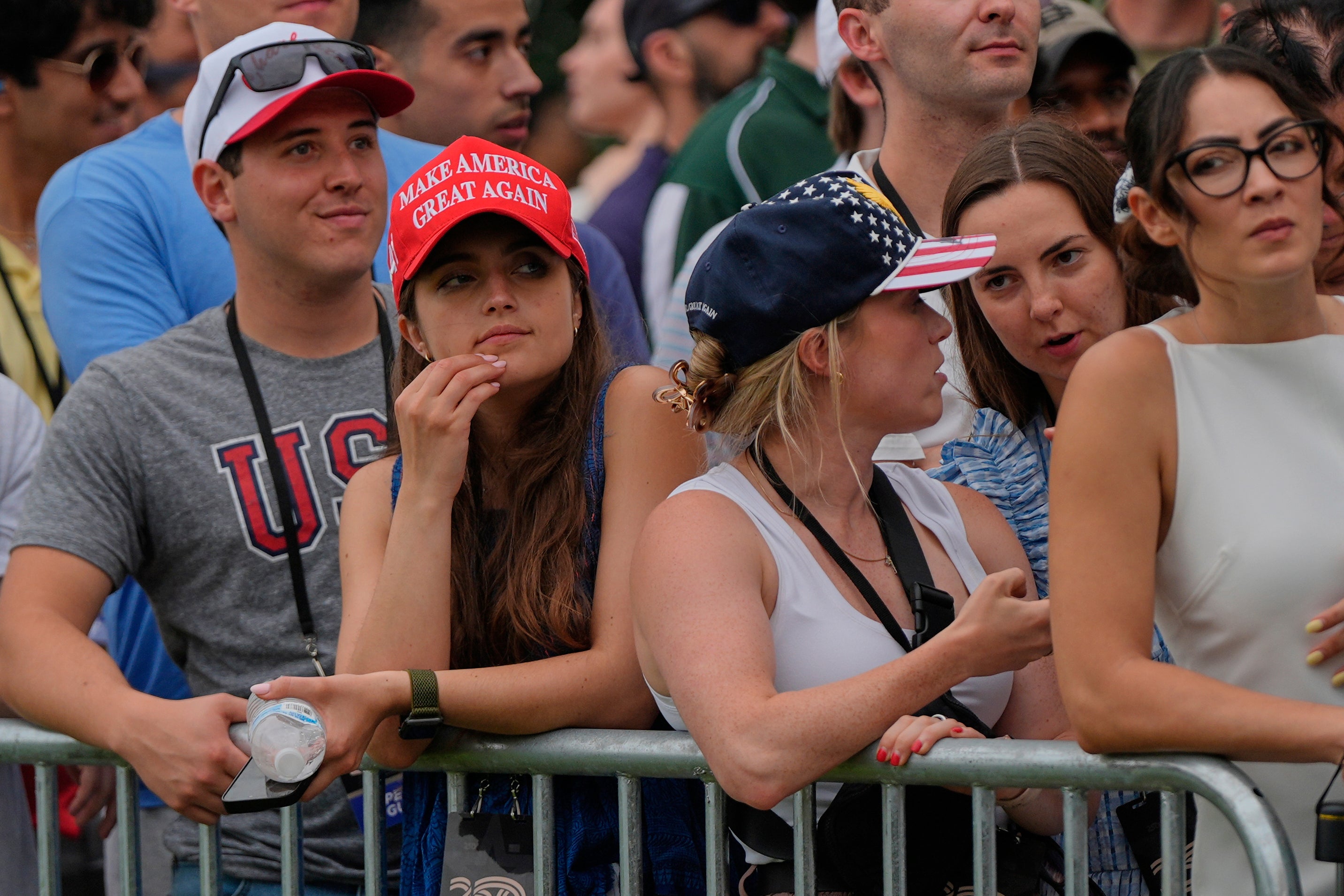 People watch a military parade commemorating the Army's 250th anniversary. The weather kept some of the crowd away from the event.