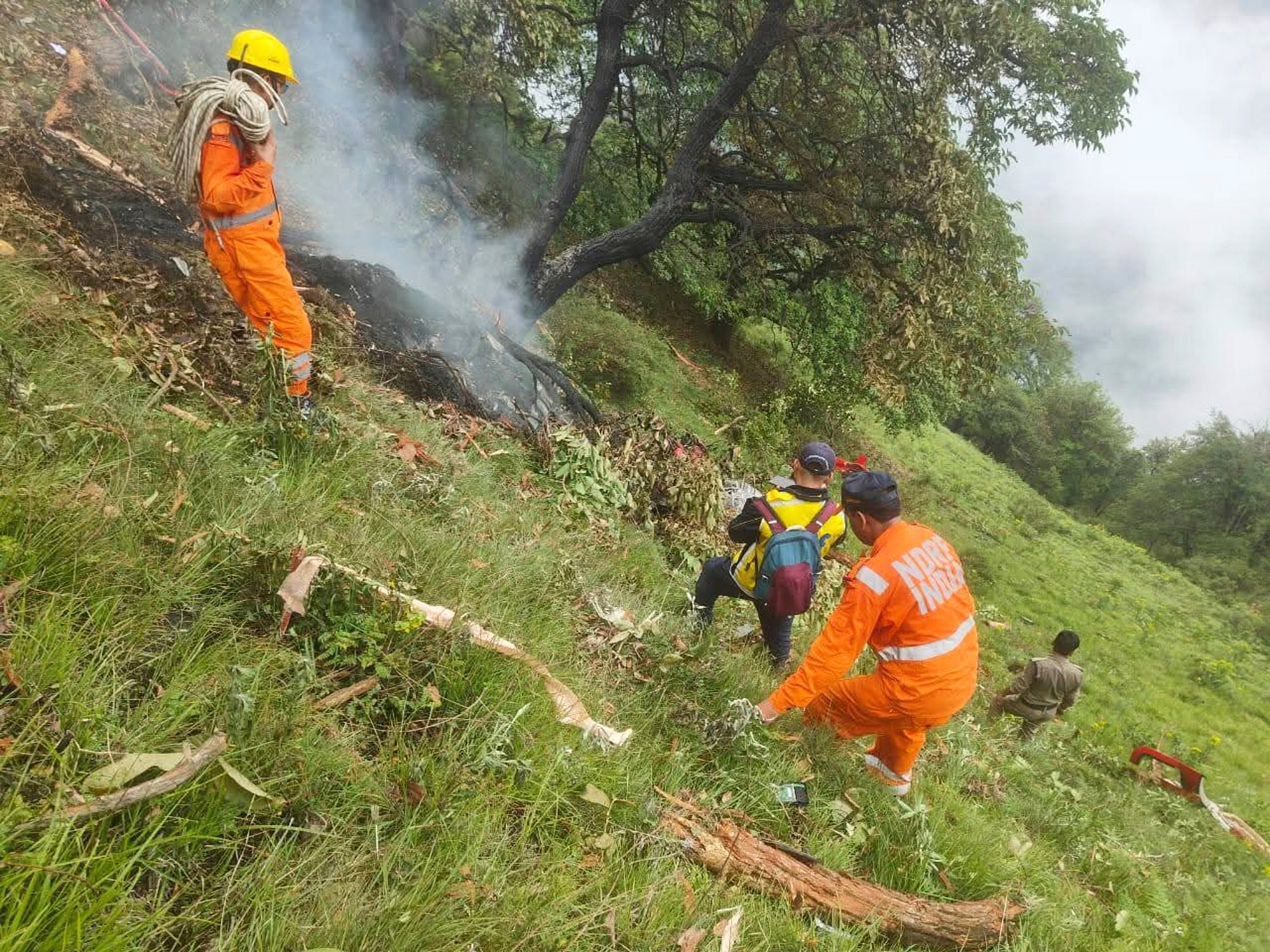 This photo shared by Uttarakhand Police on the X platform shows rescuers working at the site of a helicopter crash near Kedarnath, in Uttarakhand, India, Sunday, June 15, 2025