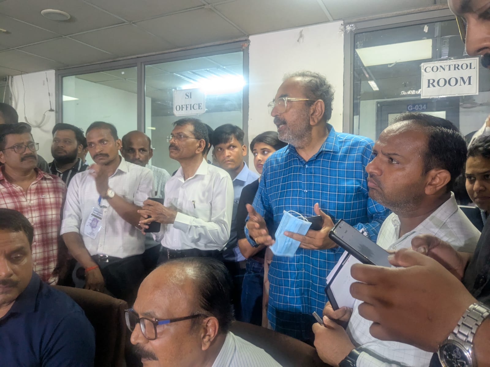 Rohit Patel (second right) lashes out at officials over the delay in the handing over of the bodies of his son and daughter-in-law in Ahmedabad on Sunday