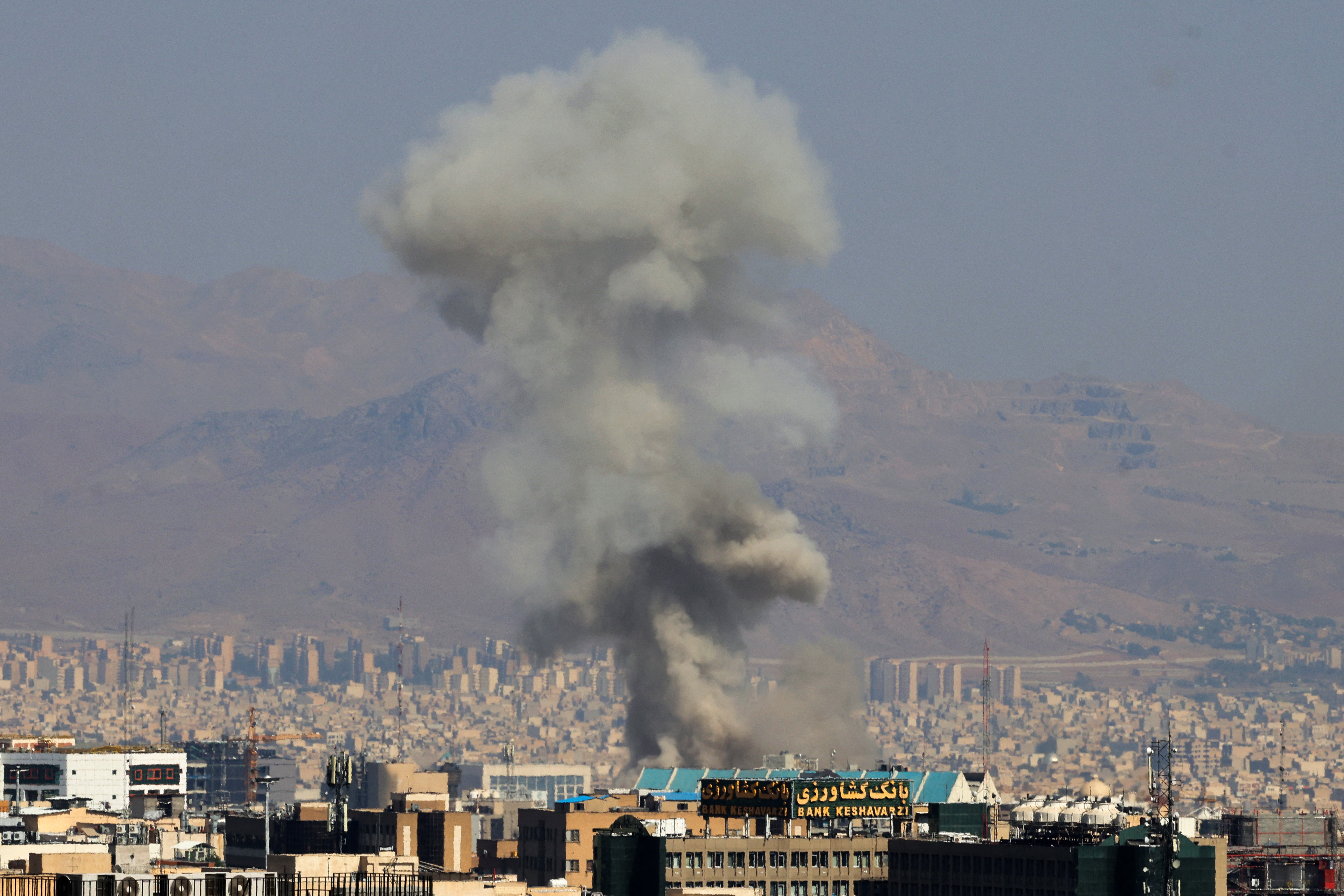 <p>Smoke billows following an Iranian strike on Tehran, on June 15</p>