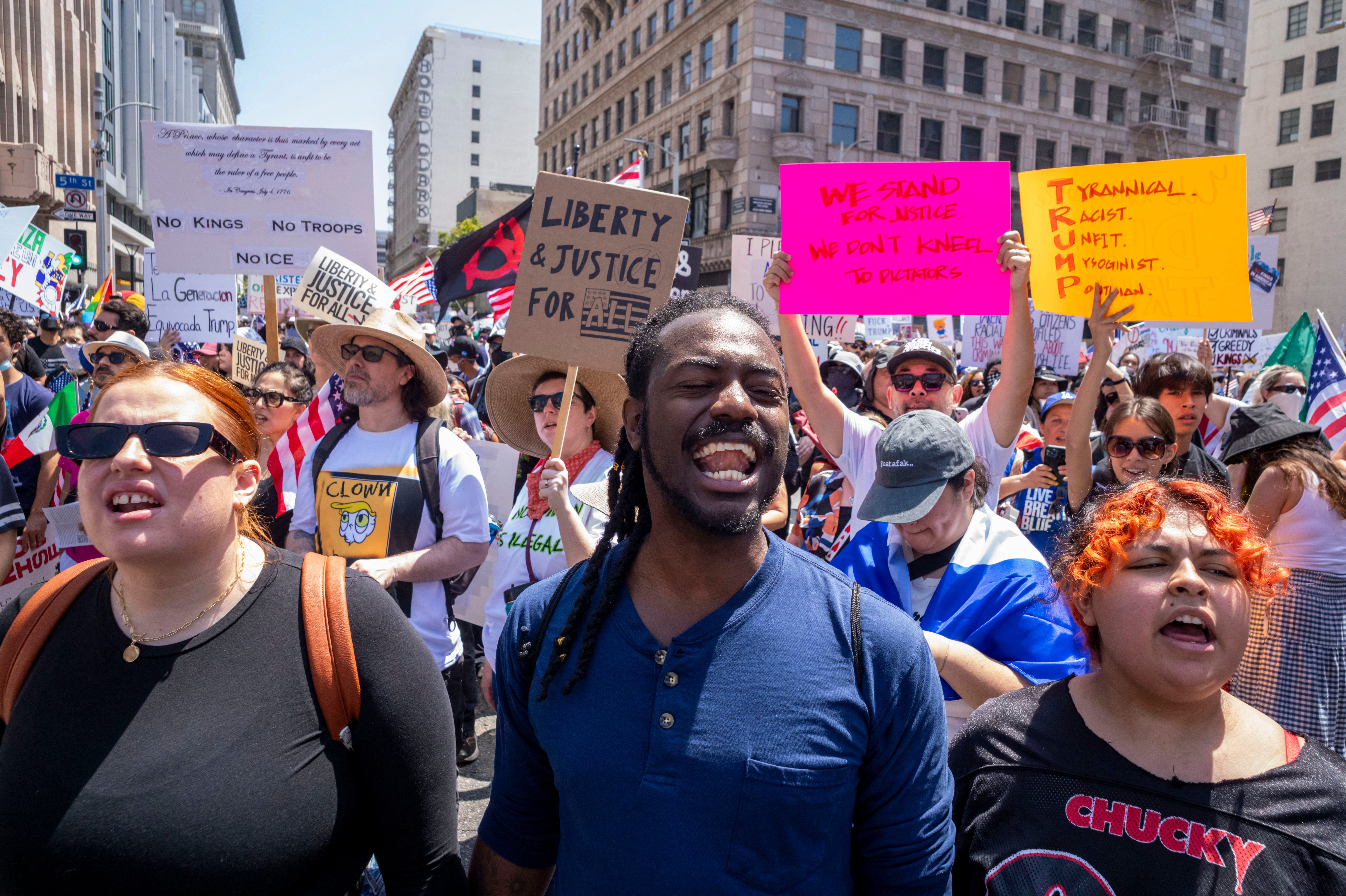 Demonstrators take part in a “No Kings” protest against the Trump administration in downtown Los Angeles, California, on June 14 2025