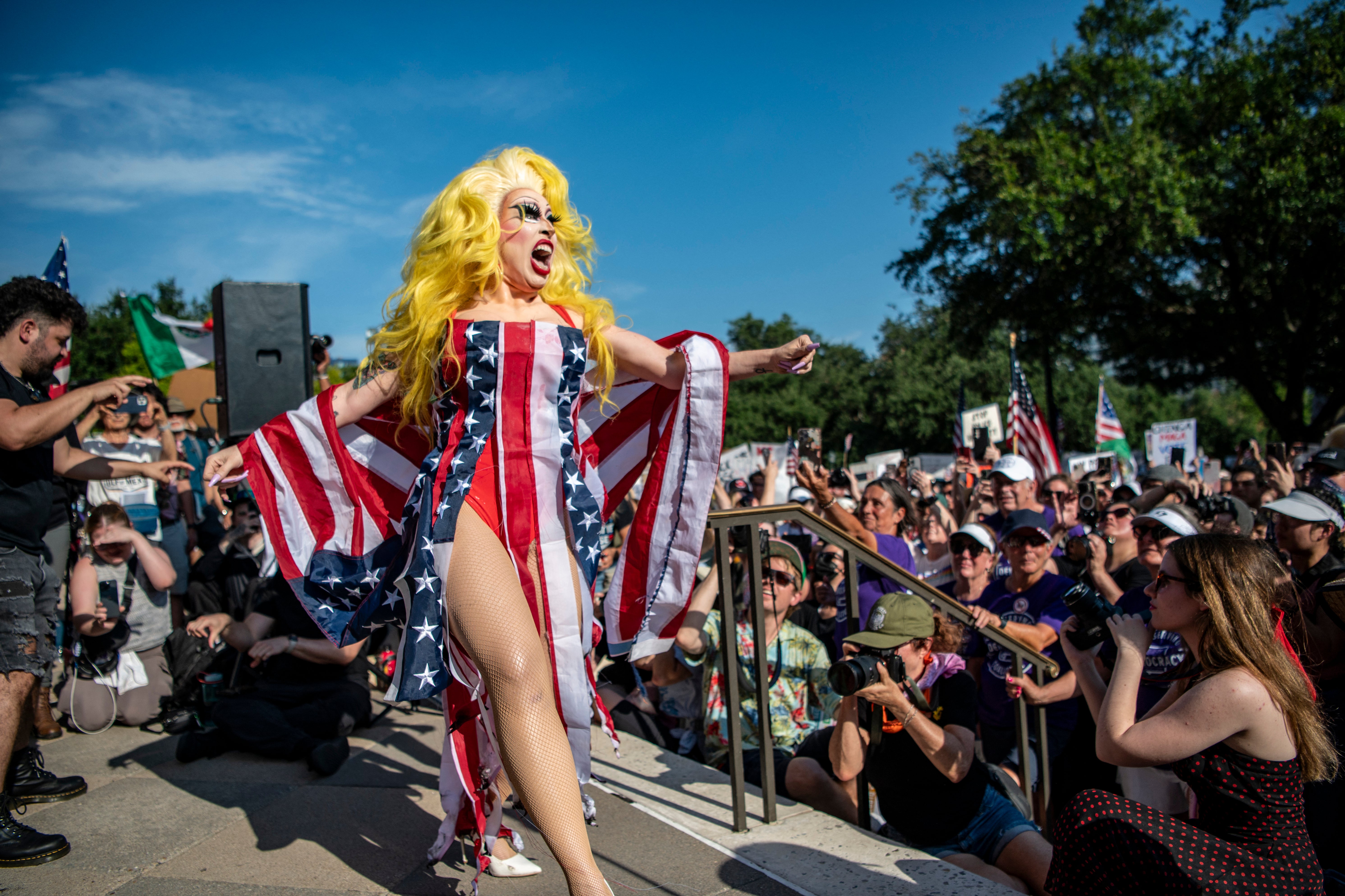A drag queen performs a routine at the Texas State Capitol in Austin during the original No Kings rally on June 14 2025