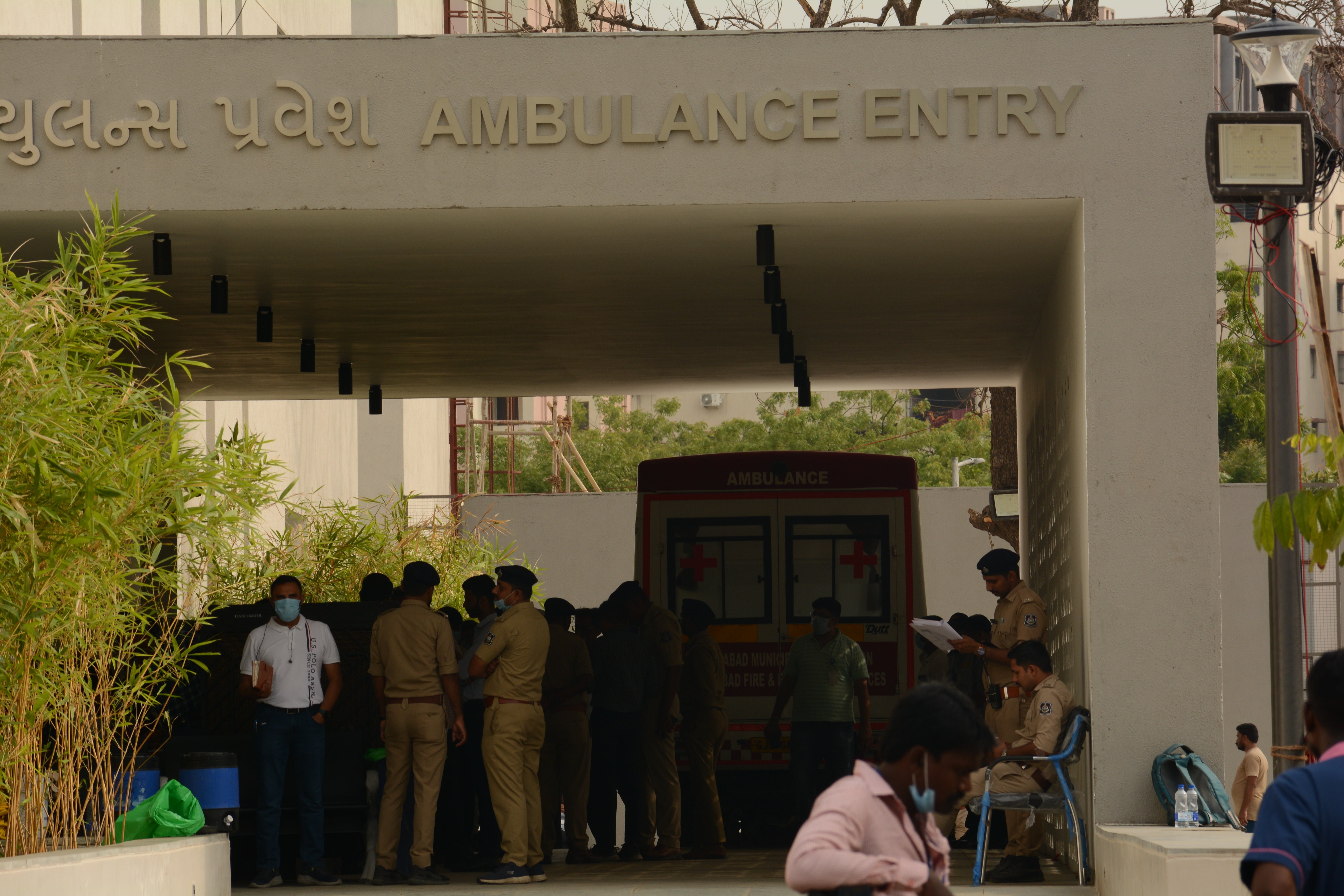 Police and ambulance outside Civil Hospital in Ahmedabad, where bodies of Air India crash victims are being identified and handed over