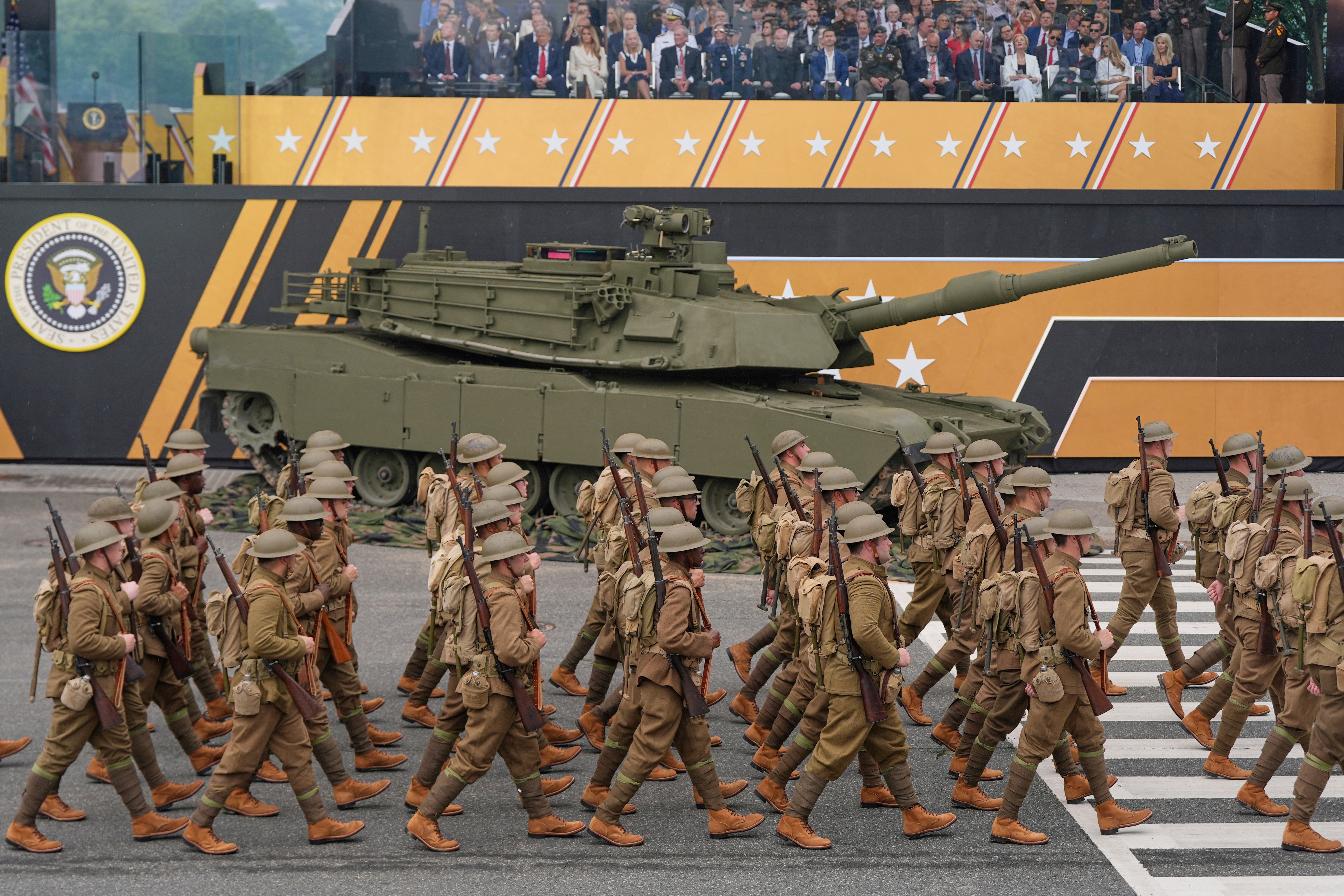 Soldiers from the Army 82nd Airborne Division, dressed in World War I era uniforms, march past the reviewing stand and President Donald Trump during a military parade commemorating the Army's 250th anniversary, coinciding with his 79th birthday, in June