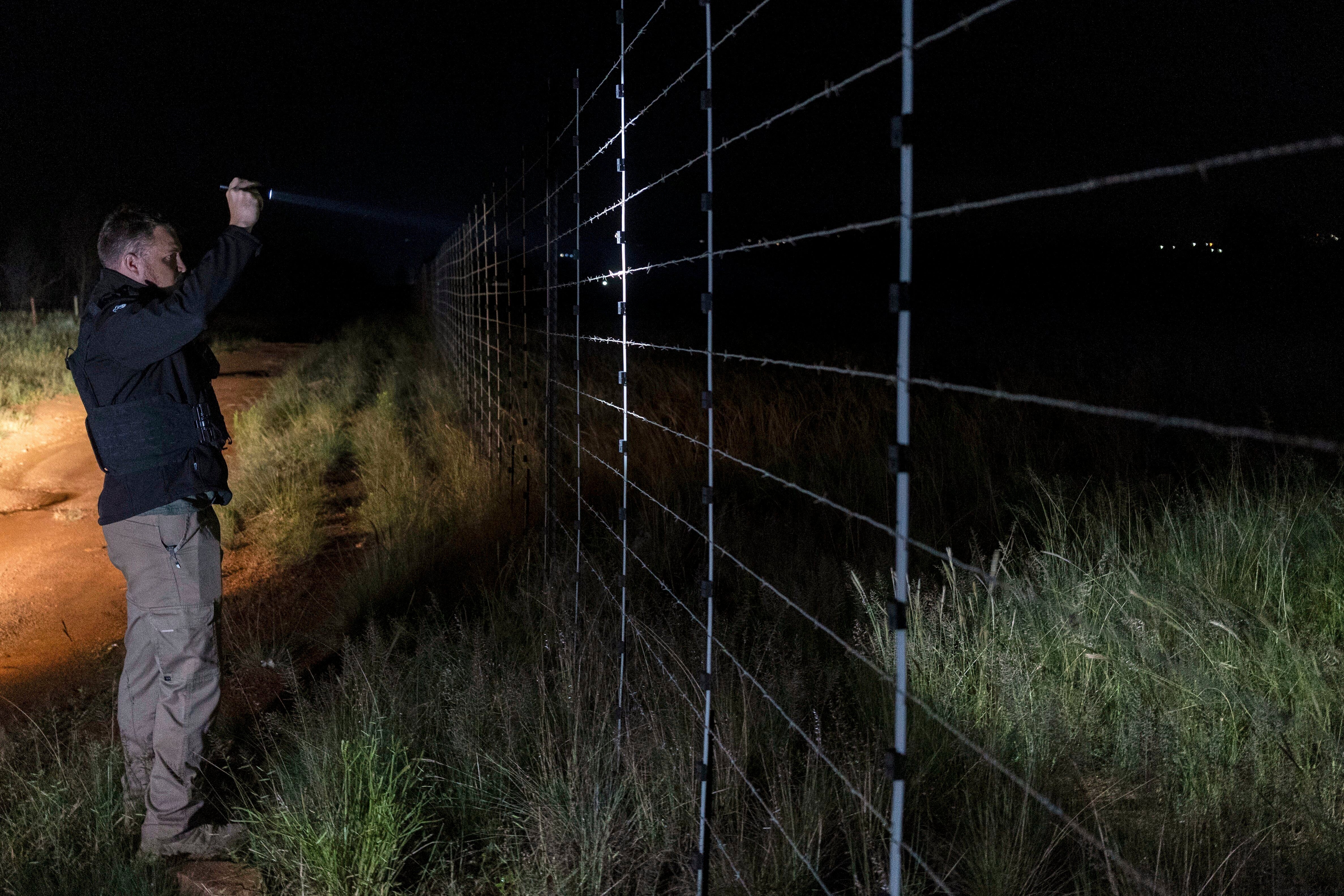Dewet Ungerer, an AfriForum coordinator, patrols a road during a neighborhood and farm security watch operation in Bashewa area, near Pretoria, South Africa